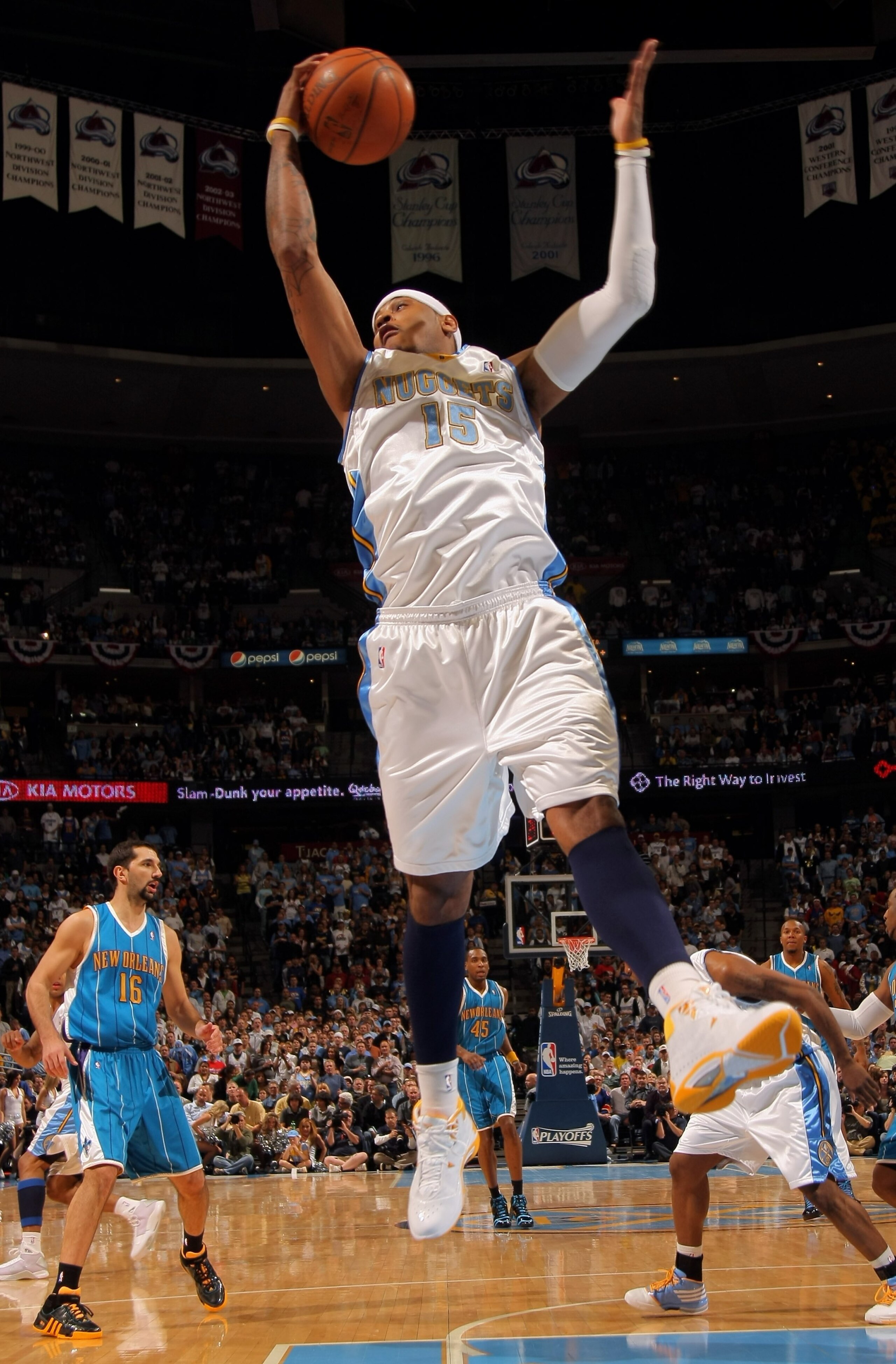 DENVER - APRIL 19:  Carmelo Anthony #15 of the Denver Nuggets grabs a rebound against the New Orleans Hornets in Game One of the Western Conference Quarterfinals during the 2009 NBA Playoffs at Pepsi Center on April 19, 2009 in Denver, Colorado. The Nugge
