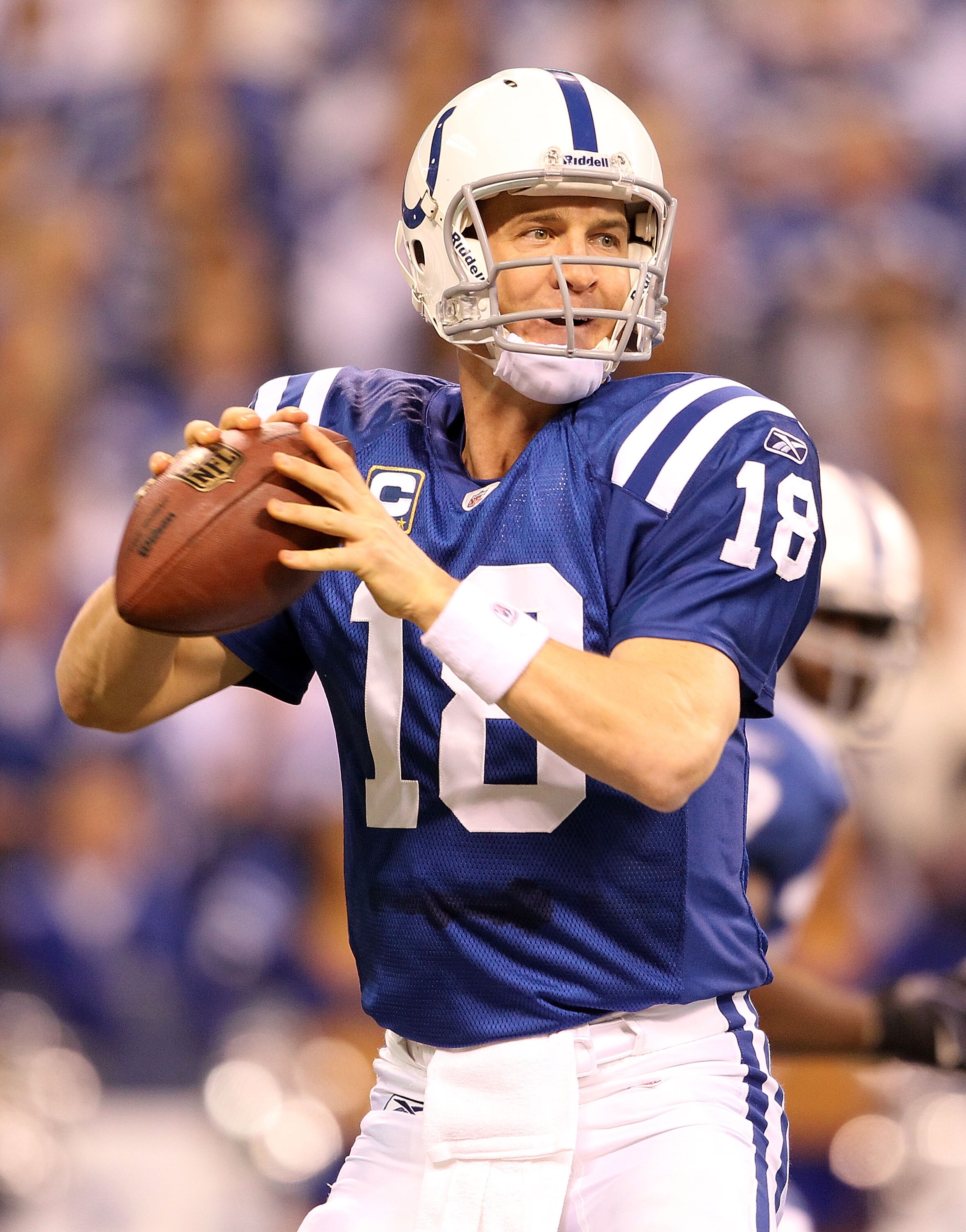 INDIANAPOLIS - JANUARY 02:  Peyton Manning #18 of the Indianapolis Colts looks to pass the ball during NFL game against the Tennessee Titans at Lucas Oil Stadium on January 2, 2011 in Indianapolis, Indiana.  (Photo by Andy Lyons/Getty Images)