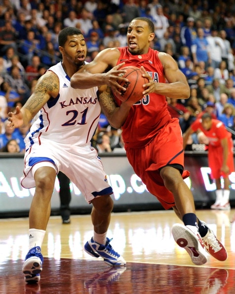 LAS VEGAS - NOVEMBER 27:  Markieff Morris #21 of the Kansas Jayhawks fouls Derrick Williams #23 of the Arizona Wildcats during the championship game of the Las Vegas Invitational at The Orleans Arena November 27, 2010 in Las Vegas, Nevada. Kansas won 87-7