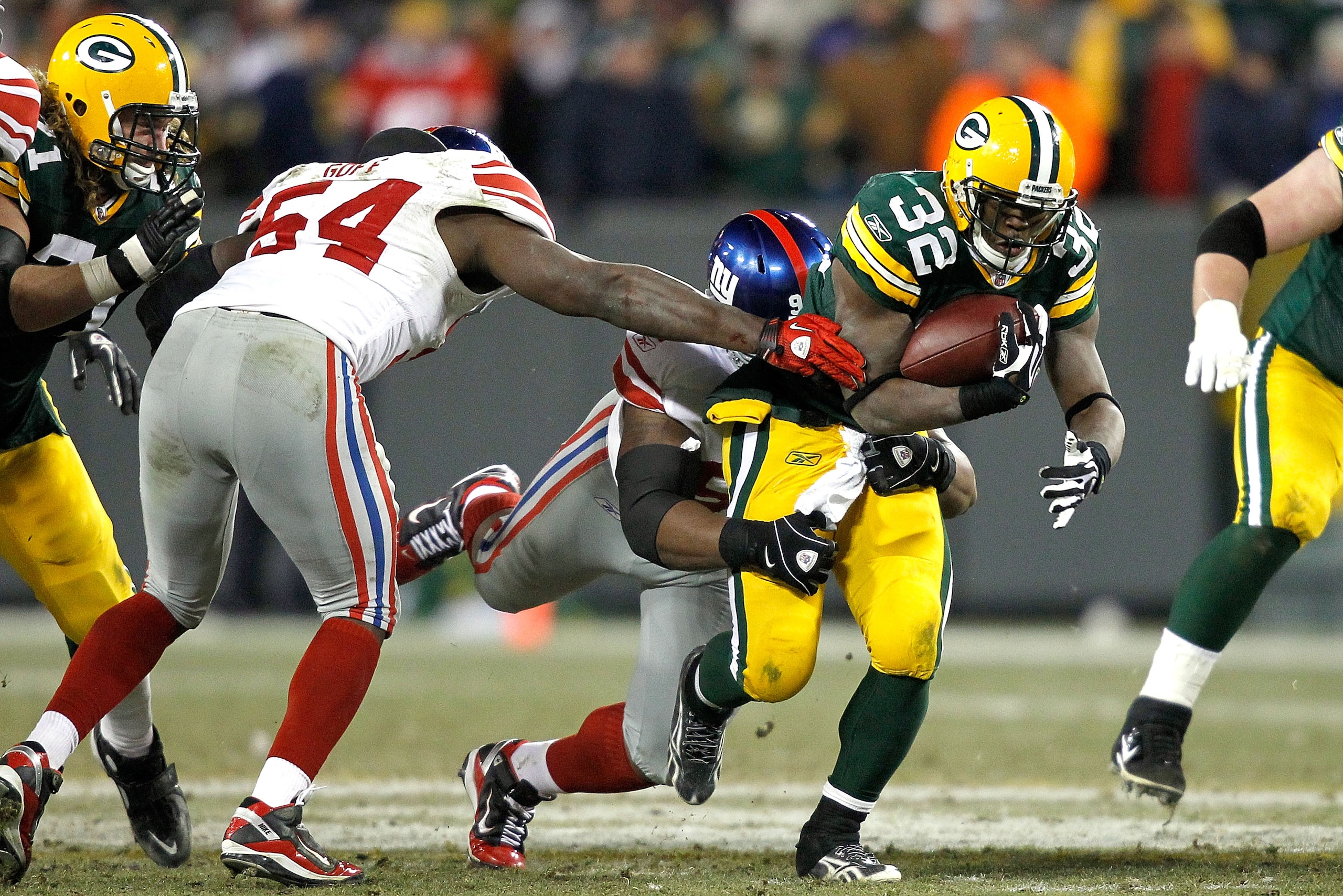 GREEN BAY, WI - DECEMBER 26: Brandon Jackson #32 of the Green Bay Packers is tackled by Linval Joseph #97 of the New York Giants at Lambeau Field on December 26, 2010 in Green Bay, Wisconsin. (Photo by Matthew Stockman/Getty Images) GREEN BAY, WI - DECEMBER 26: Brandon Jackson #32 of the Green Bay Packers is tackled by Linval Joseph #97 of the New York Giants at Lambeau Field on December 26, 2010 in Green Bay, Wisconsin. (Photo by Matthew Stockman/Getty Images)