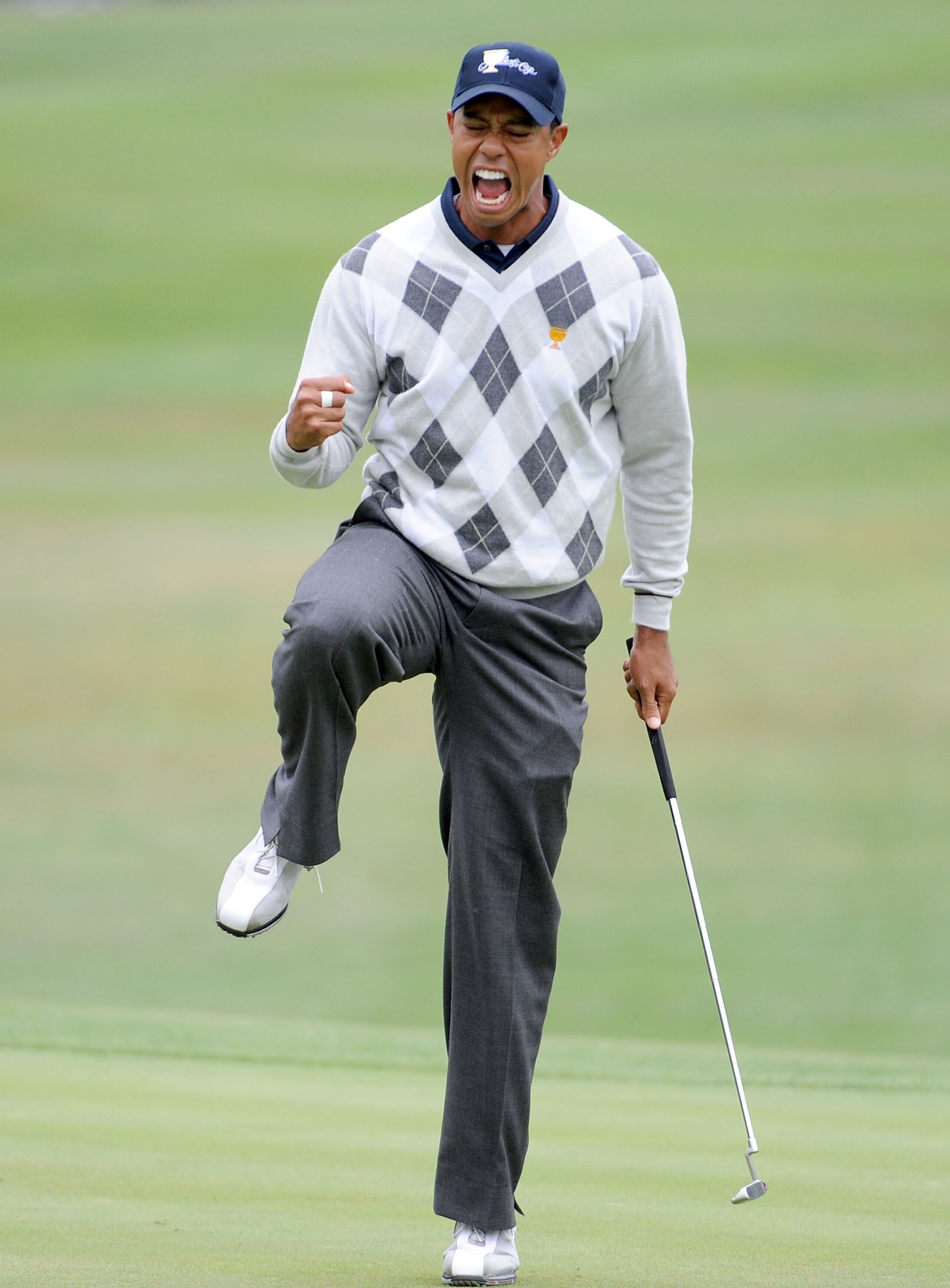 SAN FRANCISCO - OCTOBER 10:  Tiger Woods of the USA Team celebrates his putt for a birdie to win the 17th hole during the Day Three Morning Foursome Matches of The Presidents Cup at Harding Park Golf Course on October 10, 2009 in San Francisco, California