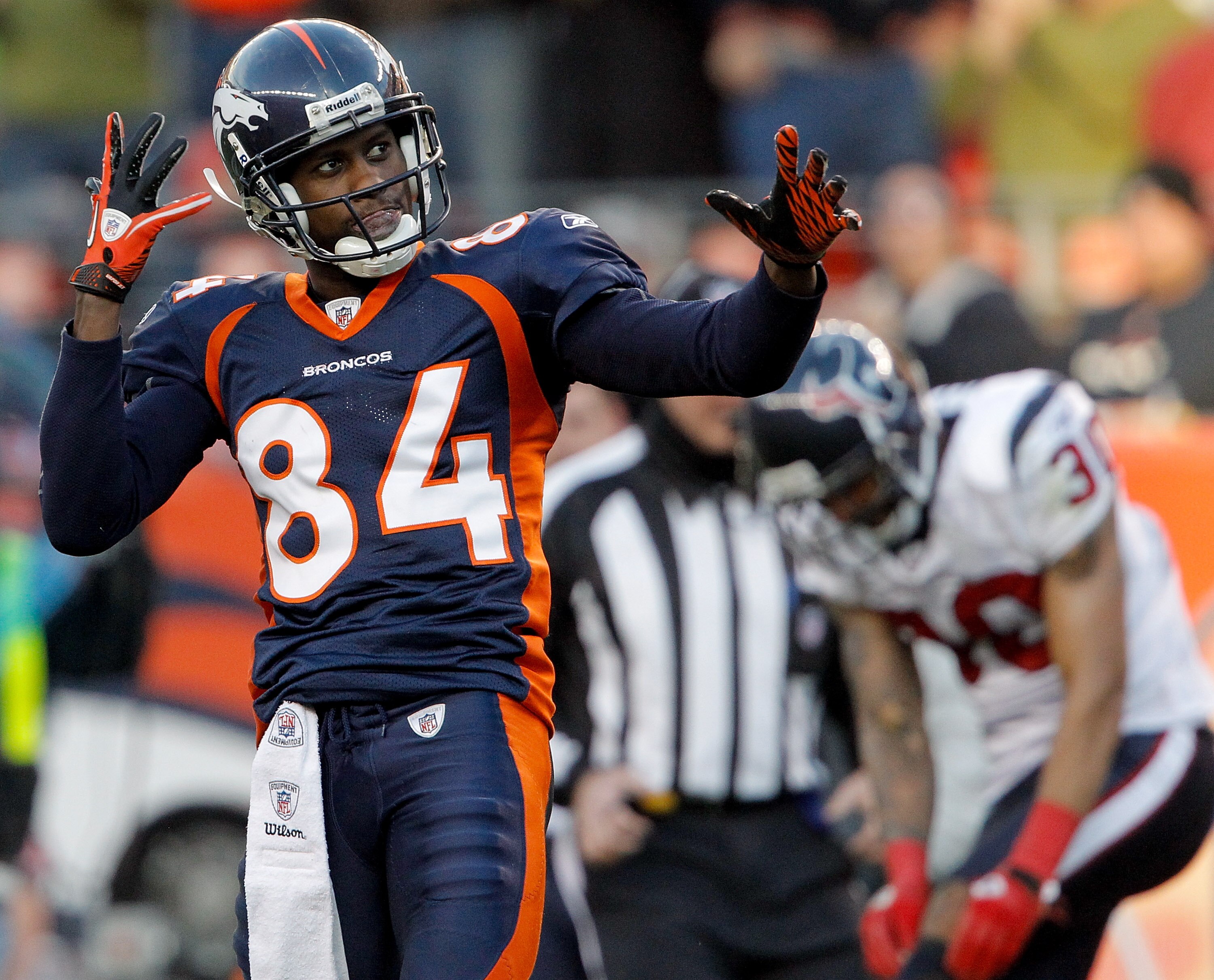 DENVER - DECEMBER 26:  Wide receiver Brandon Lloyd #84 of the Denver Broncos celebrates after a 41-yard reception against corner back Jason Allen #30 of the Houston Texans during the third quarter at INVESCO Field at Mile High on December 26, 2010 in Denv