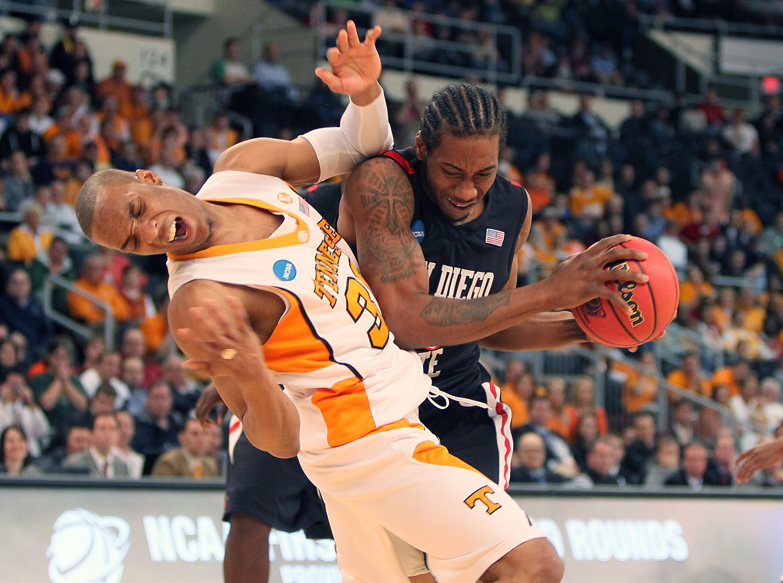 PROVIDENCE, RI - MARCH 19:  Kawhi Leonard #15 of San Diego State Aztecs collides with J.P. Prince #30 of Tennessee Volunteers during the first round of the 2010 NCAA men's basketball tournament at Dunkin' Donuts Center on March 19, 2010 in Providence, Rho