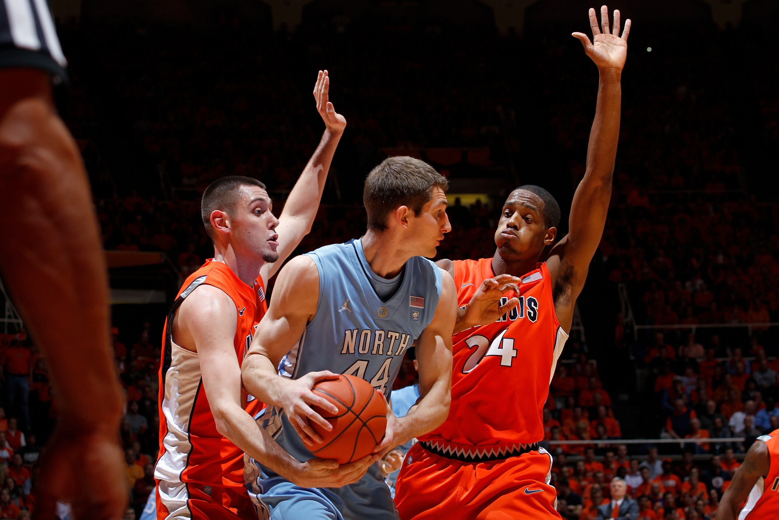 CHAMPAIGN, IL - NOVEMBER 30: Mike Tisdale #54 and Mike Davis #24 of the Illinois Fighting Illini defend against Tyler Zeller #44 of the North Carolina Tar Heels during the 2010 ACC/Big Ten Challenge at Assembly Hall on November 30, 2010 in Champaign, Illi