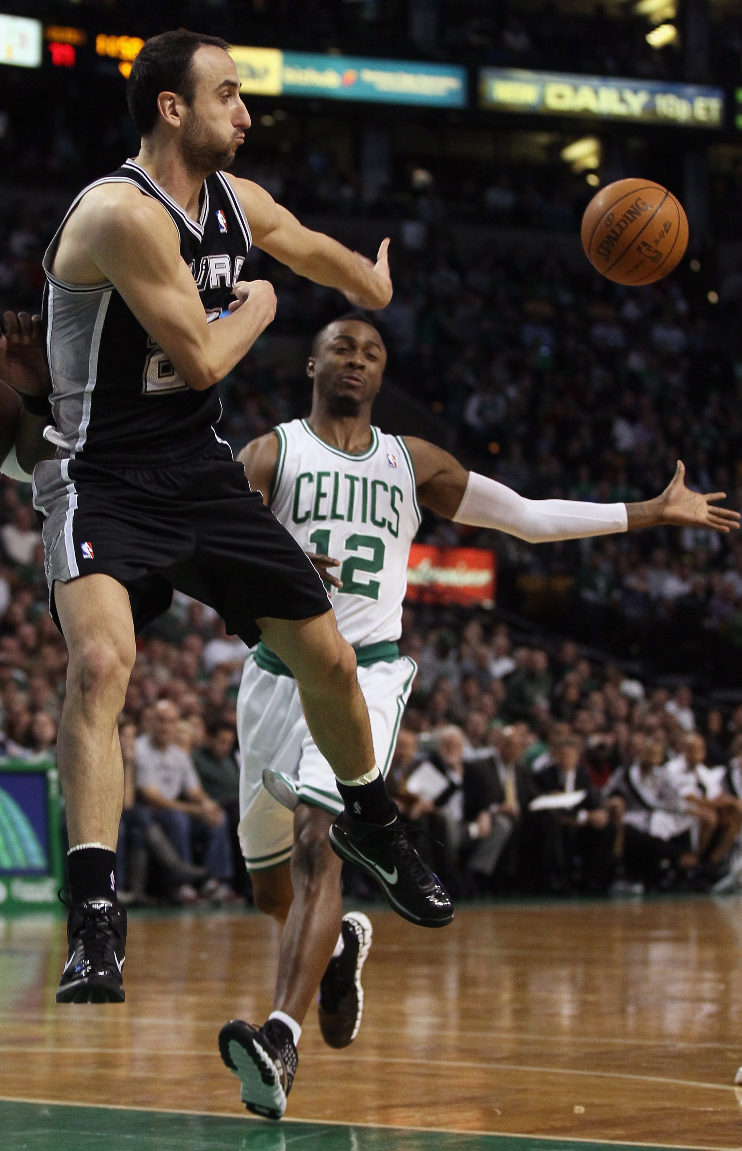 BOSTON, MA - JANUARY 05:  Manu Ginobili #20 of the San Antonio Spurs passes the ball as Von Wafer #12 of the Boston Celtics defends on January 5, 2011 at the TD Garden in Boston, Massachusetts. The Celtics defeated the Spurs 105-103. NOTE TO USER: User ex