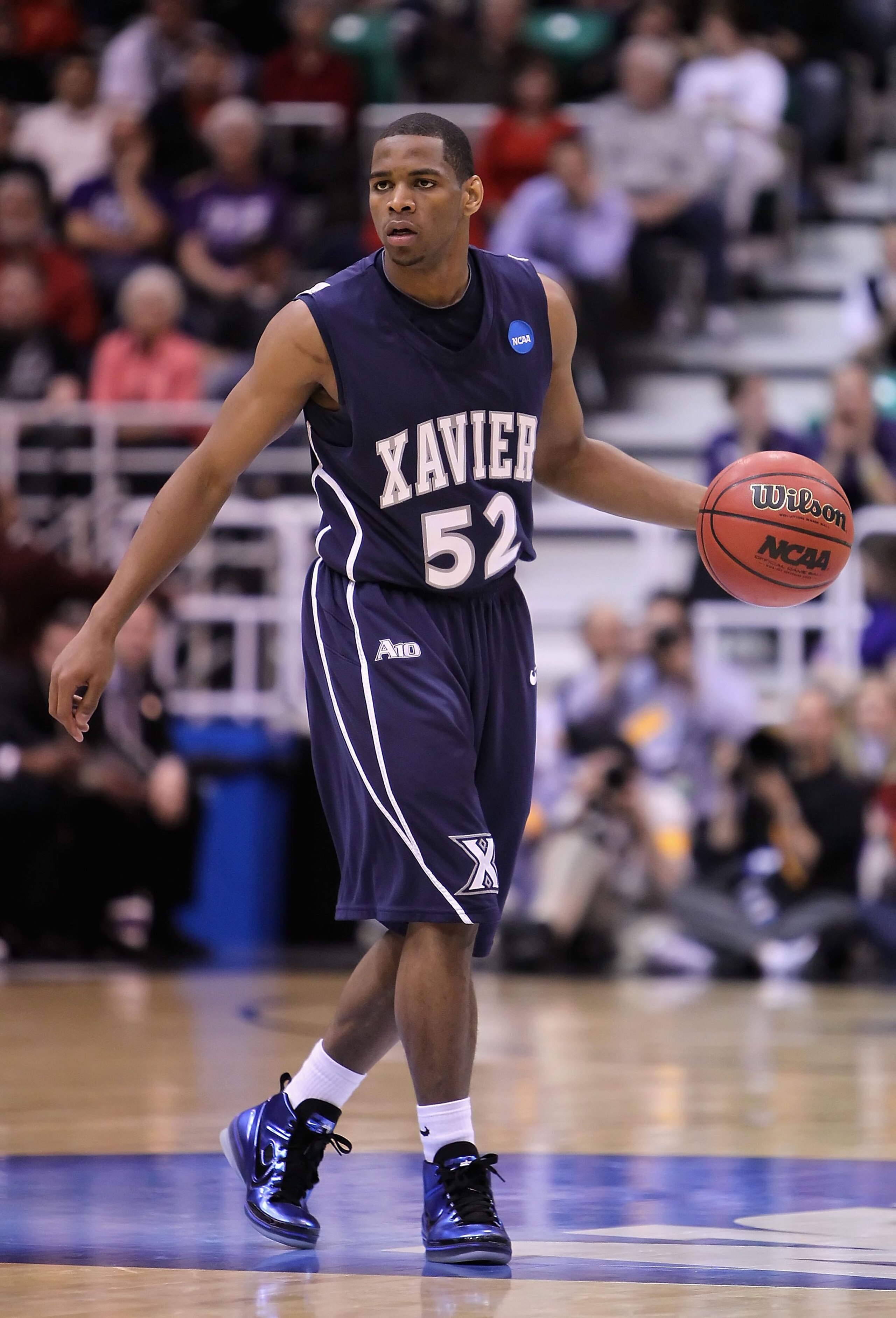 SALT LAKE CITY - MARCH 25:  Terrell Holloway #52 of the Xavier Musketeers handles the ball against the Kansas State Wildcats during the west regional semifinal of the 2010 NCAA men's basketball tournament at the Energy Solutions Arena on March 25, 2010 in