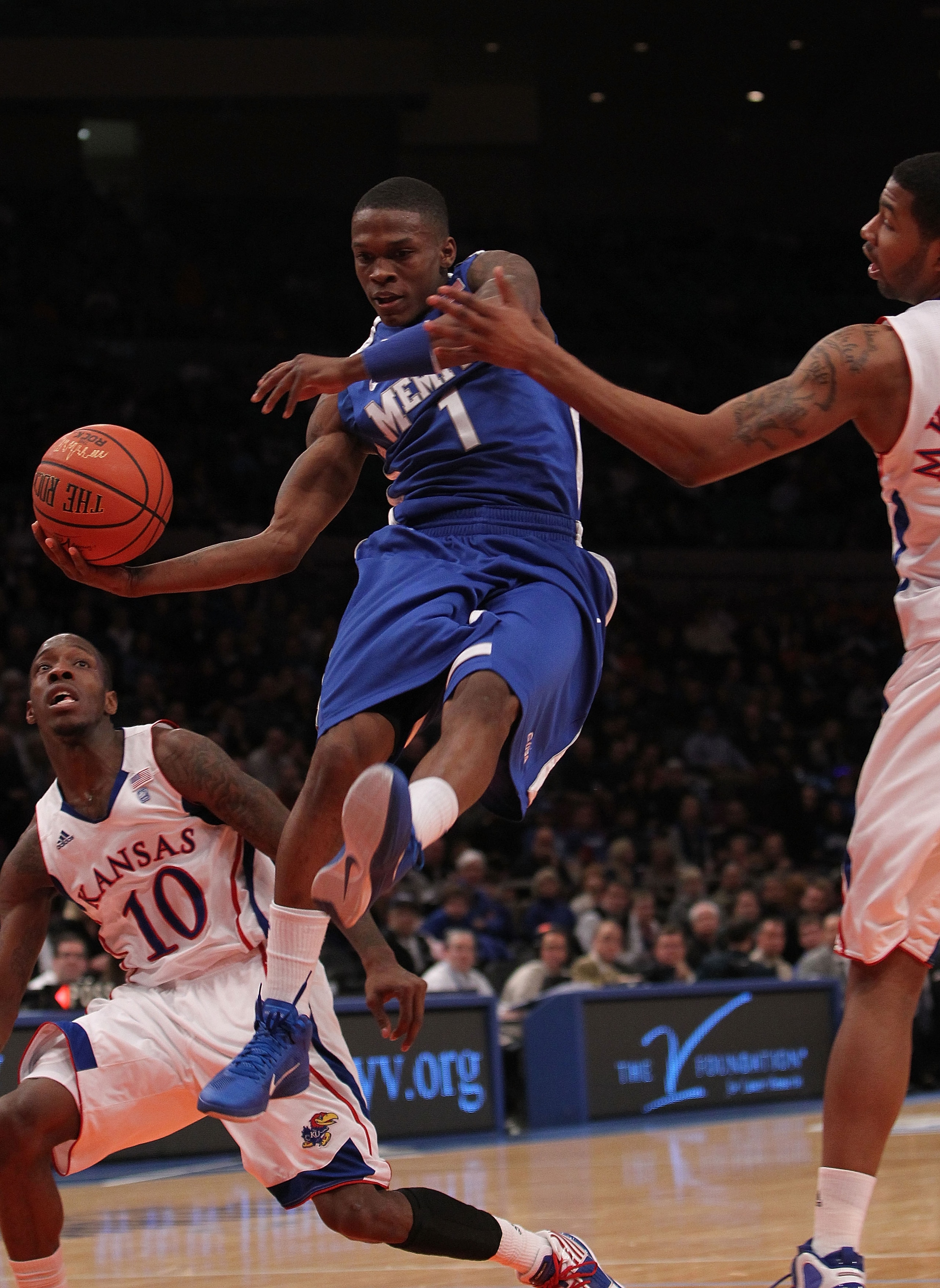 NEW YORK, NY - DECEMBER 07:  Joe Jackson #1 of the Memphis Tigers passes the ball in the lane against the Kansas Jayhawks during their game at the Jimmy V Classic at Madison Square Garden on December 7, 2010 in New York City.  (Photo by Nick Laham/Getty I