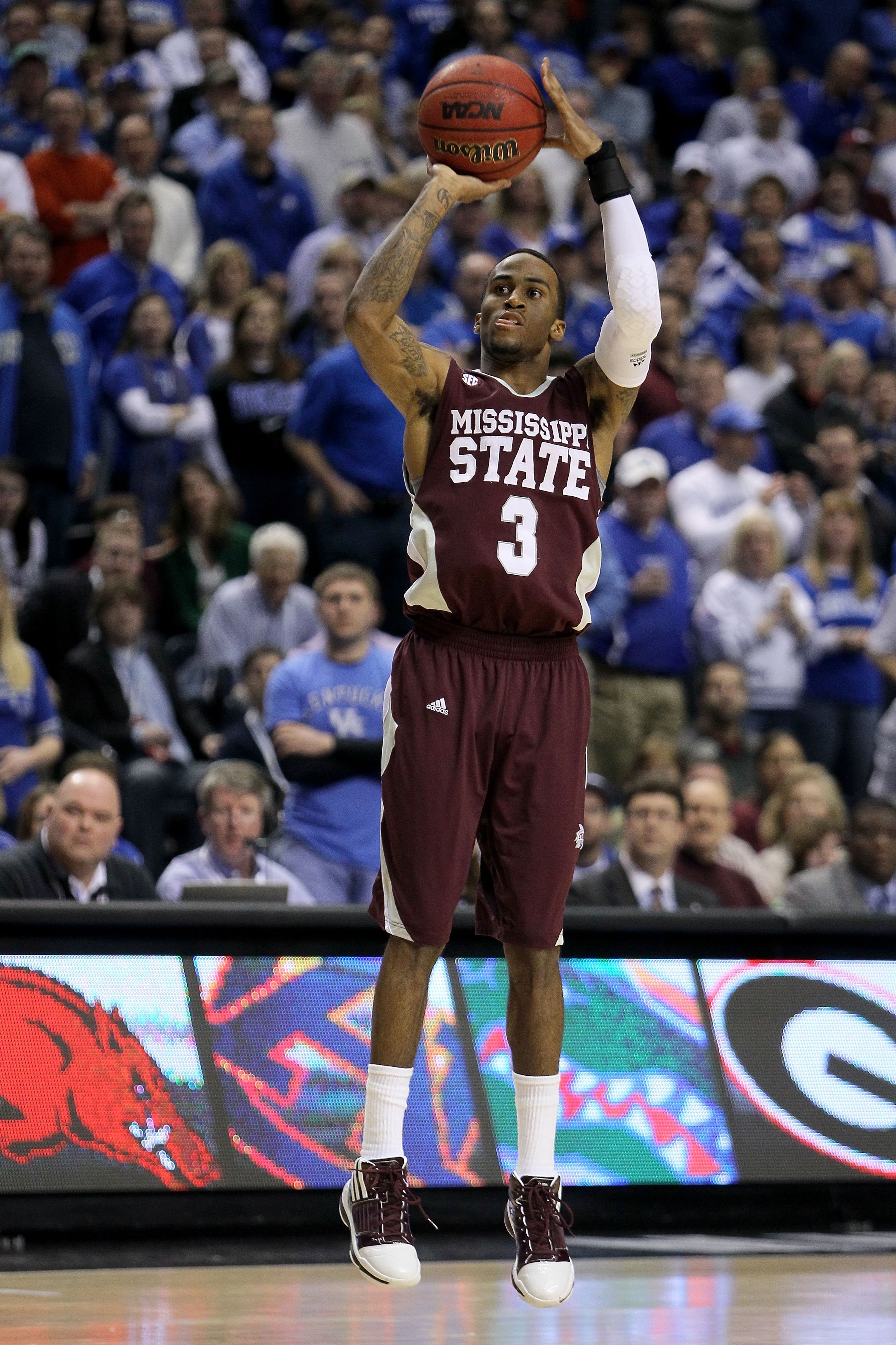 NASHVILLE, TN - MARCH 14:  Dee Bost #3 of the Mississippi State Bulldogs attempts a shot against the Kentucky Wildcats during the final of the SEC Men's Basketball Tournament at the Bridgestone Arena on March 14, 2010 in Nashville, Tennessee. Kentucky won