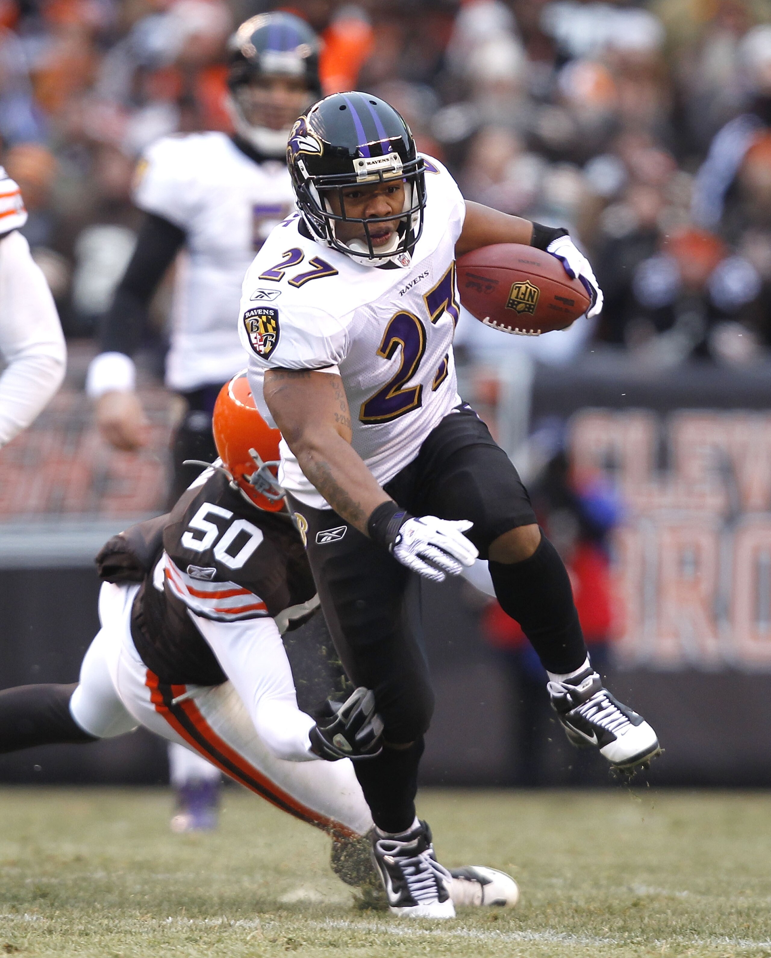 CLEVELAND - DECEMBER 26:  Running back Ray Rice #27 of the Baltimore Ravens runs by linebacker Eric Barton #50 of the Cleveland Browns at Cleveland Browns Stadium on December 26, 2010 in Cleveland, Ohio.  (Photo by Matt Sullivan/Getty Images)