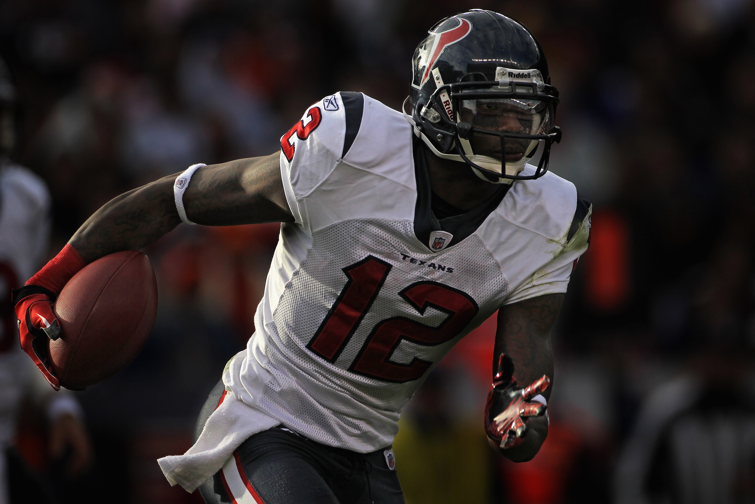 DENVER - DECEMBER 26:  Wide receiver Jacoby Jones #12 of the Houston Texas advances the ball against the Denver Broncos at INVESCO Field at Mile High on December 26, 2010 in Denver, Colorado.  (Photo by Doug Pensinger/Getty Images)