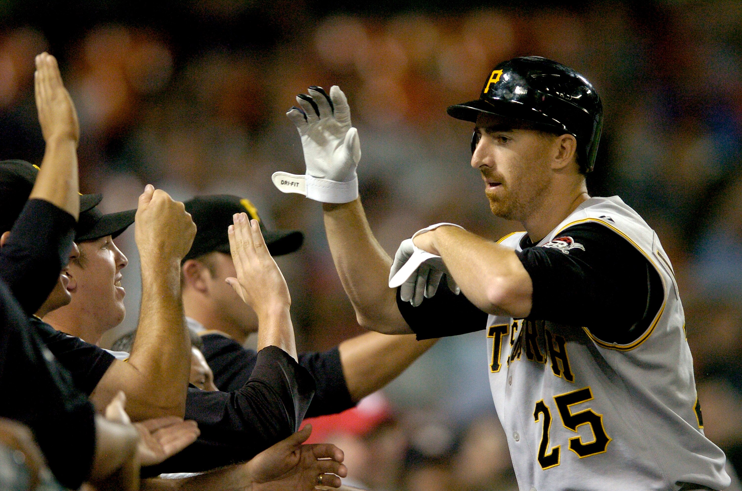 WASHINGTON - JUNE 6:  Adam LaRoche #25 of the Pittsburgh Pirates is congratulated by teammates after hitting a three-run home run in the eighth inning against the Washington Nationals at RFK Stadium June 6, 2007 in Washington, DC.  (Photo by Greg Fiume/Ge