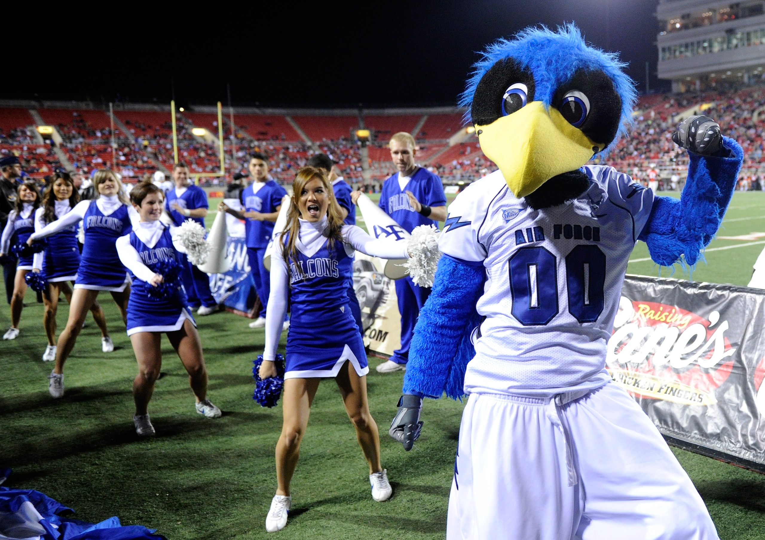 LAS VEGAS - NOVEMBER 18:  The Air Force Falcons mascot The Bird performs with cheerleaders during the team's game against the UNLV Rebels at Sam Boyd Stadium November 18, 2010 in Las Vegas, Nevada. Air Force won 35-20.  (Photo by Ethan Miller/Getty Images