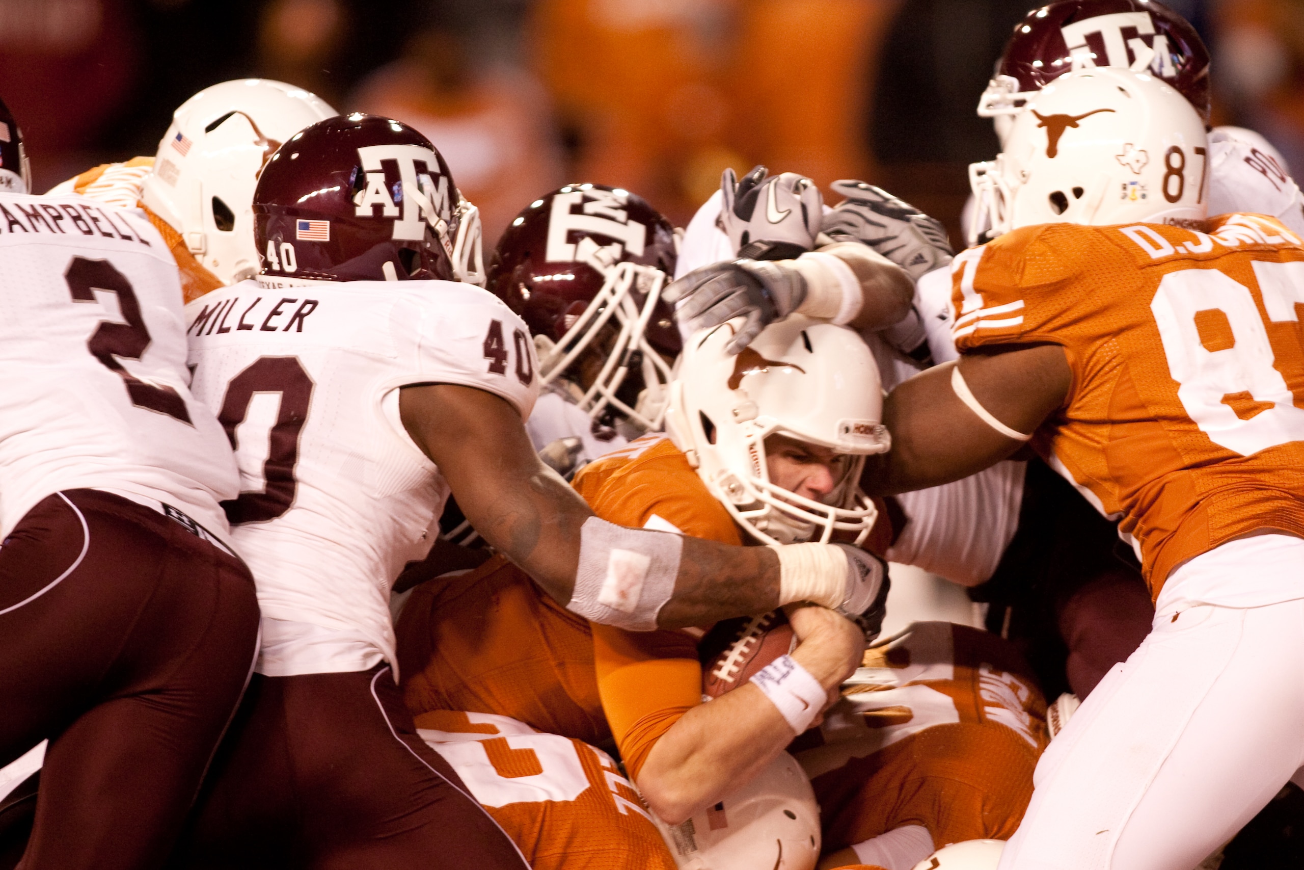 AUSTIN, TX - NOVEMBER 25:  University of Texas quarterback Garrett Gilbert #7 scores a touchdown during the second half against Texas A&M at Darrell K. Royal-Texas Memorial Stadium on November 25, 2010 in Austin, Texas. (Photo by Darren Carroll/Getty Imag