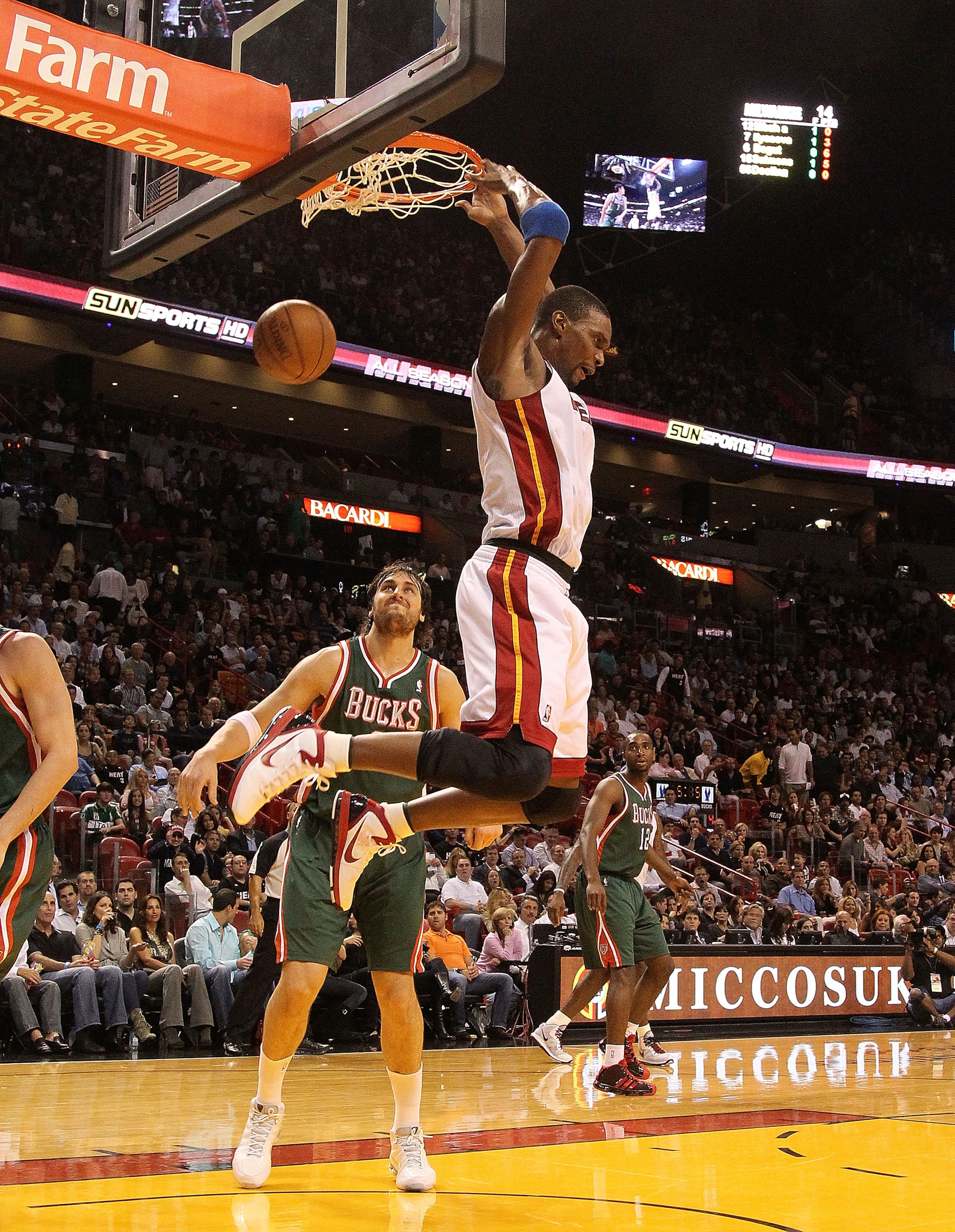 MIAMI, FL - JANUARY 04: Chris Bosh #1 of the Miami Heat dunks during a game against the Milwaukee Bucks at American Airlines Arena on January 4, 2011 in Miami, Florida. NOTE TO USER: User expressly acknowledges and agrees that, by downloading and/or using