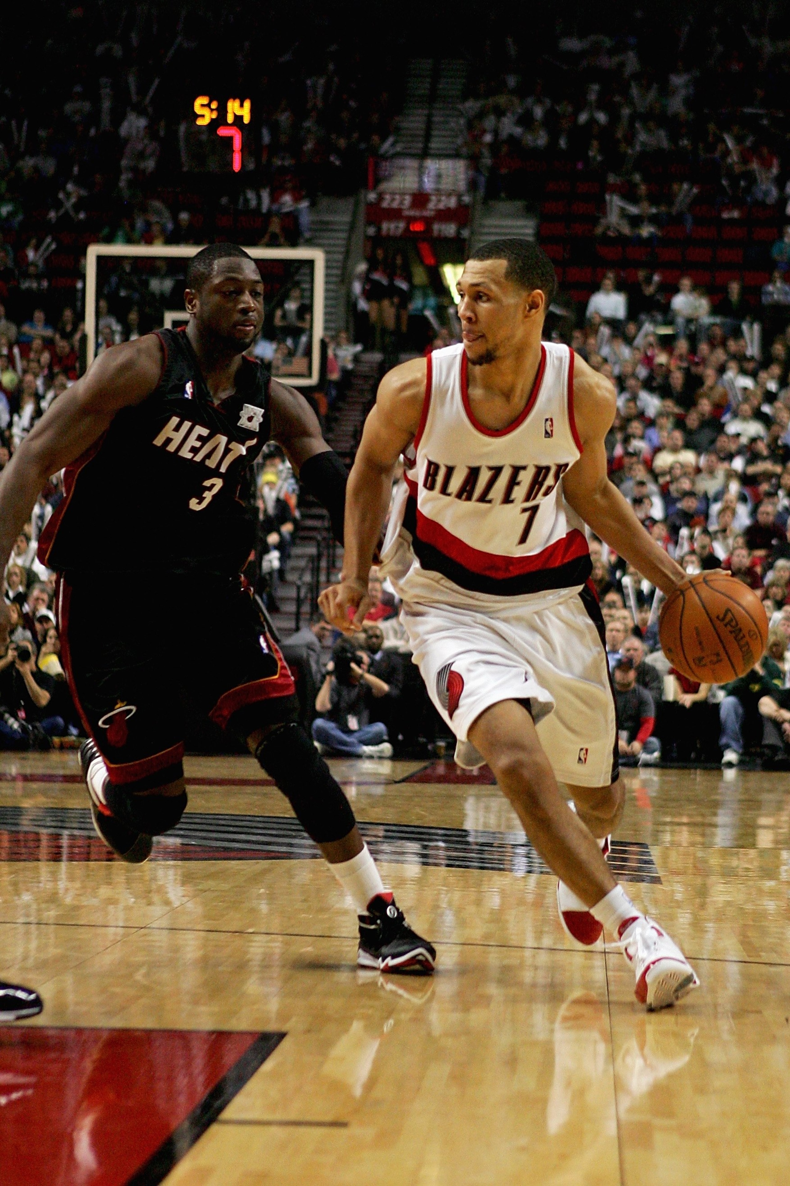PORTLAND, OR - DECEMBER 6:  Brandon Roy #7 of the Portland Trail Blazers drives to the basket trailed by Dwyane Wade #3 of the Miami Heat  during the game on December 6, 2007 at the Rose Garden in Portland, Oregon.  The Blazers won 112-106.  NOTE TO USER: