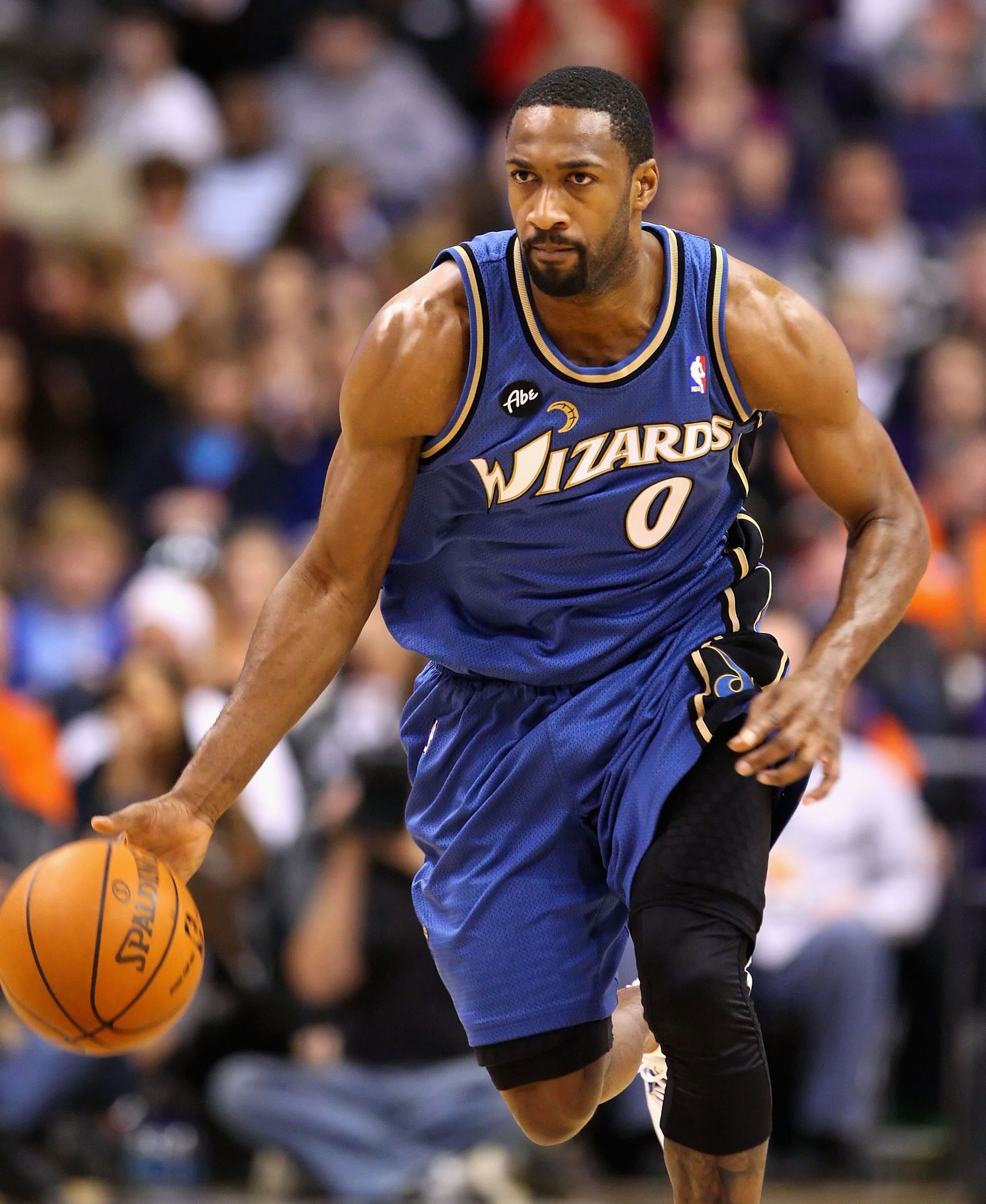 PHOENIX - DECEMBER 19:  Gilbert Arenas #0 of the Washington Wizards hanldles the ball during the NBA game against the Phoenix Suns at US Airways Center on December 19, 2009 in Phoenix, Arizona. The Suns defeated the Wizards 121-95. NOTE TO USER: User expr