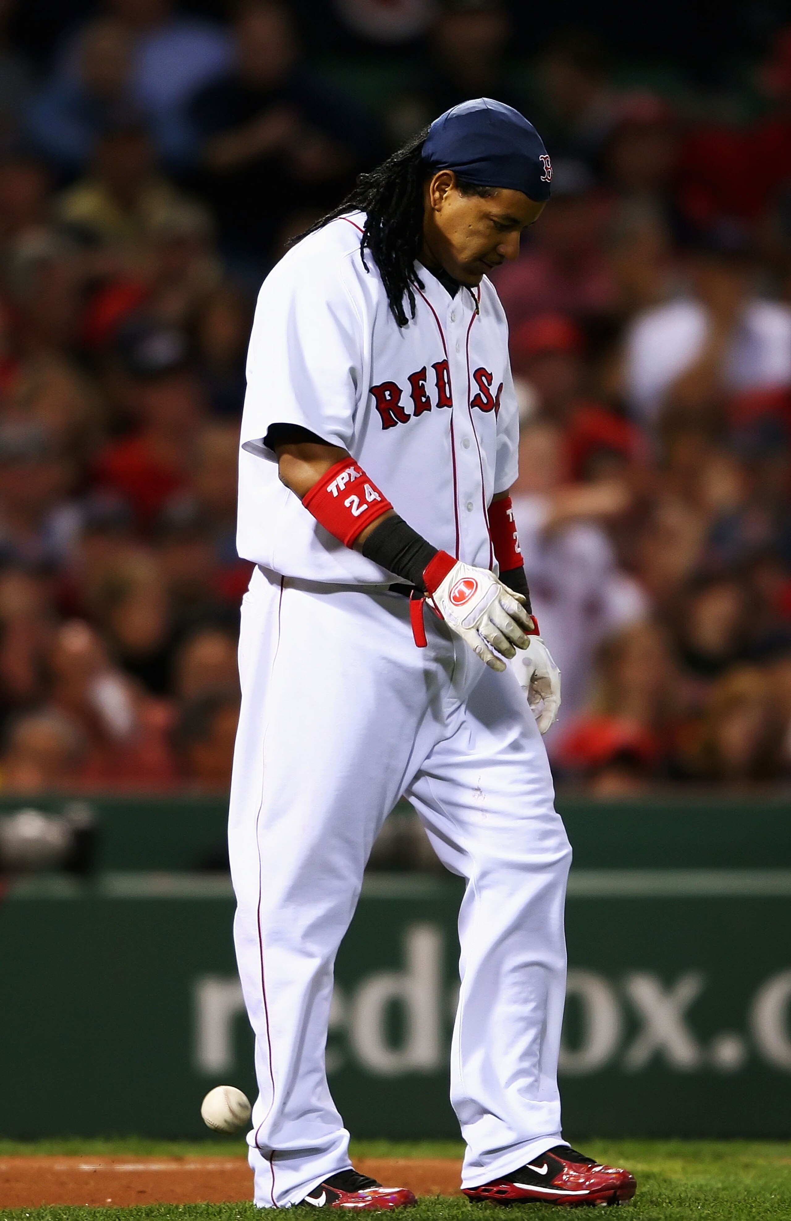 BOSTON - OCTOBER 21:  Manny Ramirez #24 of the Boston Red Sox reacts after striking out in the fifth inning against the Cleveland Indians in Game Seven of the American League Championship Series at Fenway Park on October 21, 2007 in Boston, Massachusetts.
