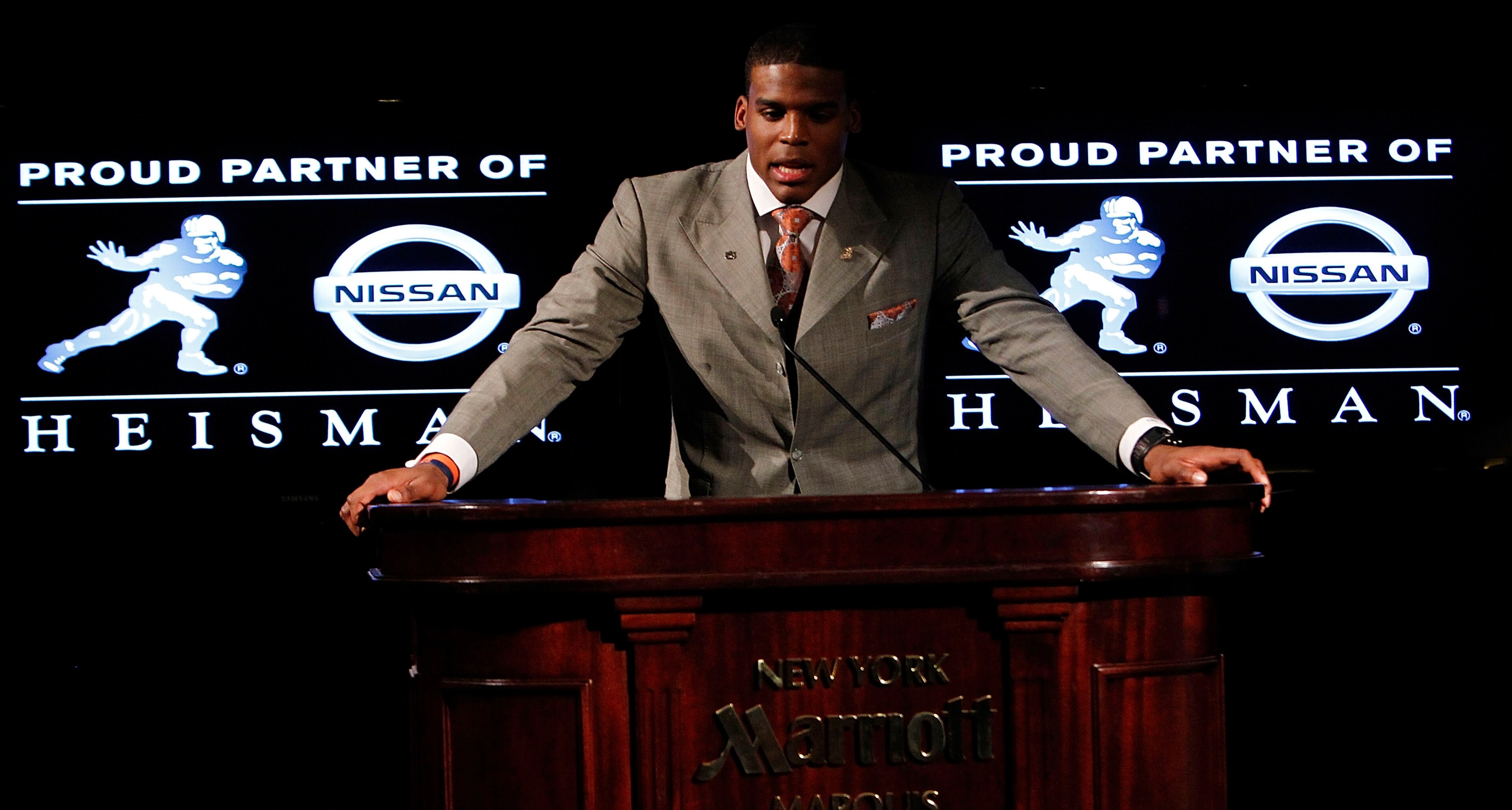 NEW YORK - DECEMBER 11: Cam Newton, quarterback of the Auburn University Tigers, speaks after being awarded the 2010 Heisman Memorial Trophy Award on December 11, 2010 in New York City. (Photo by Jeff Zelevansky/Getty Images) NEW YORK - DECEMBER 11: Cam Newton, quarterback of the Auburn University Tigers, speaks after being awarded the 2010 Heisman Memorial Trophy Award on December 11, 2010 in New York City. (Photo by Jeff Zelevansky/Getty Images)