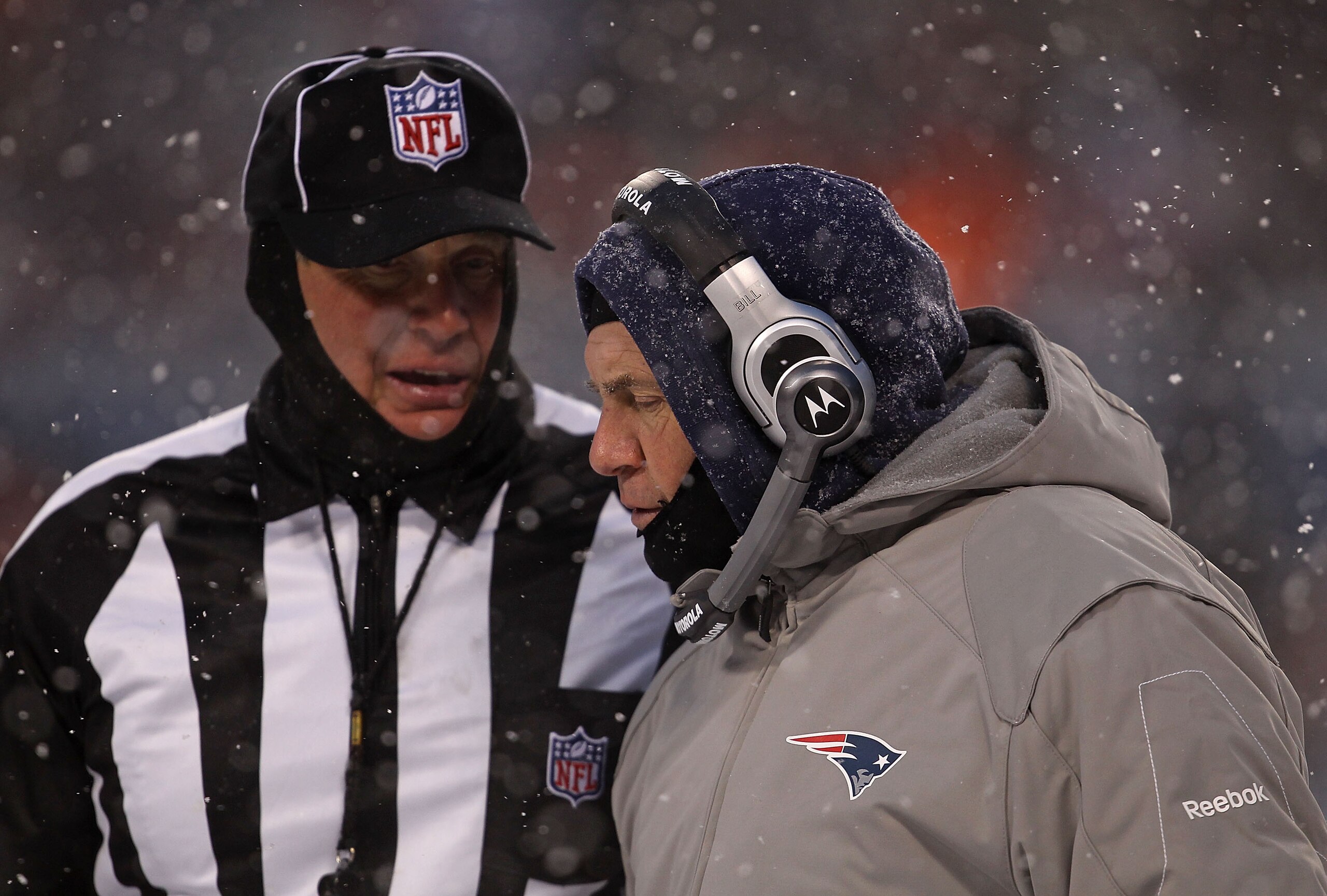 CHICAGO, IL - DECEMBER 12: Head coach Bill Belichick of the New England Patriots talks with a referee during a game against the Chicago Bears at Soldier Field on December 12, 2010 in Chicago, Illinois. The Patriots defeated the Bears 36-7. (Photo by Jonat