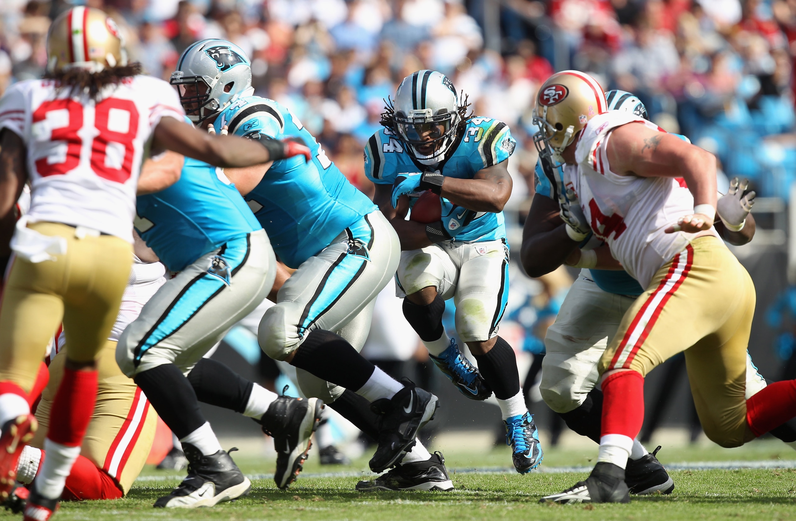 CHARLOTTE, NC - OCTOBER 24:  DeAngelo Williams #34 of the Carolina Panthers runs with the ball against the San Francisco 49ers during their game at Bank of America Stadium on October 24, 2010 in Charlotte, North Carolina.  (Photo by Streeter Lecka/Getty I
