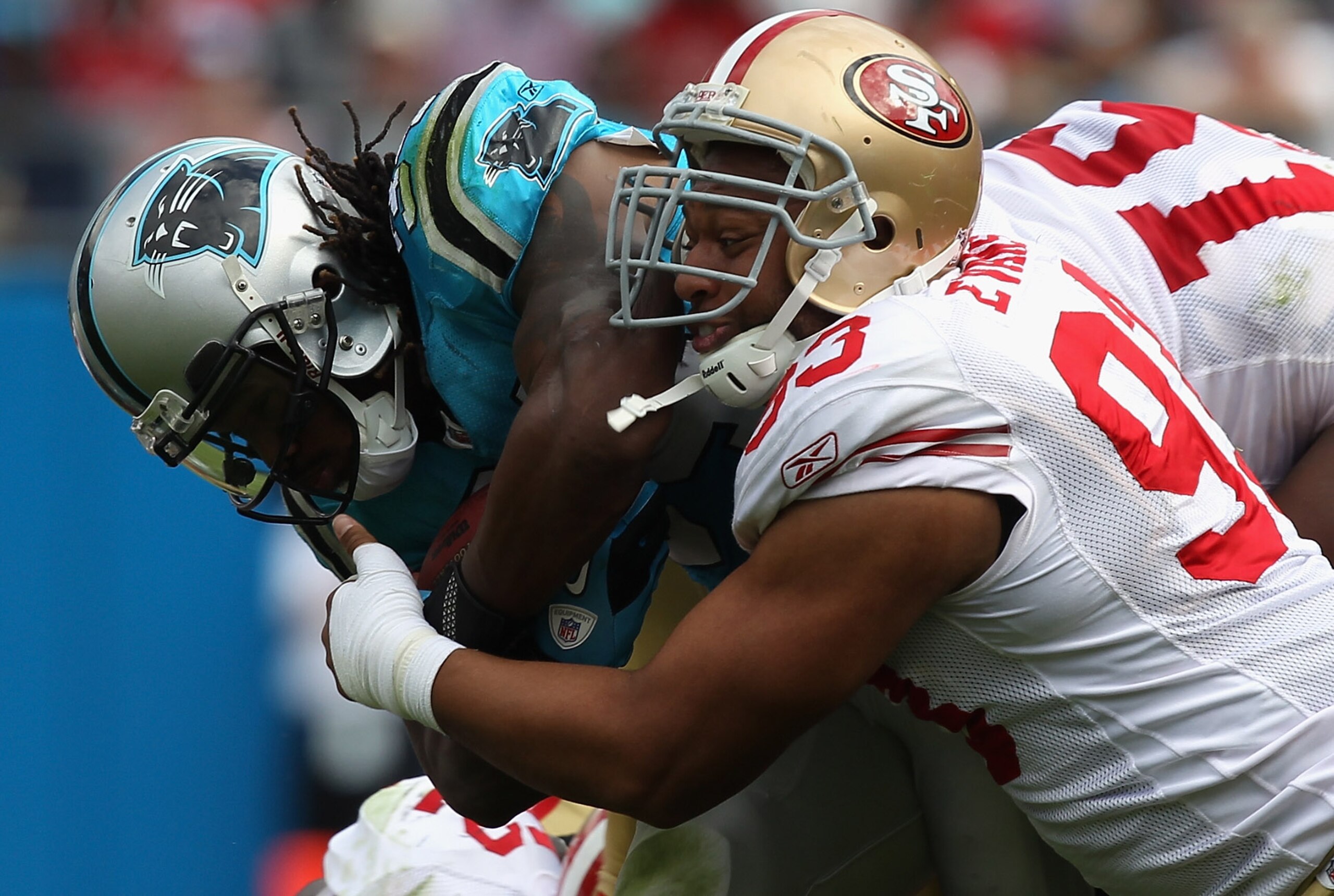 CHARLOTTE, NC - OCTOBER 24:  Demetric Evans #93 of the San Francisco 49ers tackles DeAngelo Williams #34 of the Carolina Panthers during their game at Bank of America Stadium on October 24, 2010 in Charlotte, North Carolina.  (Photo by Streeter Lecka/Gett