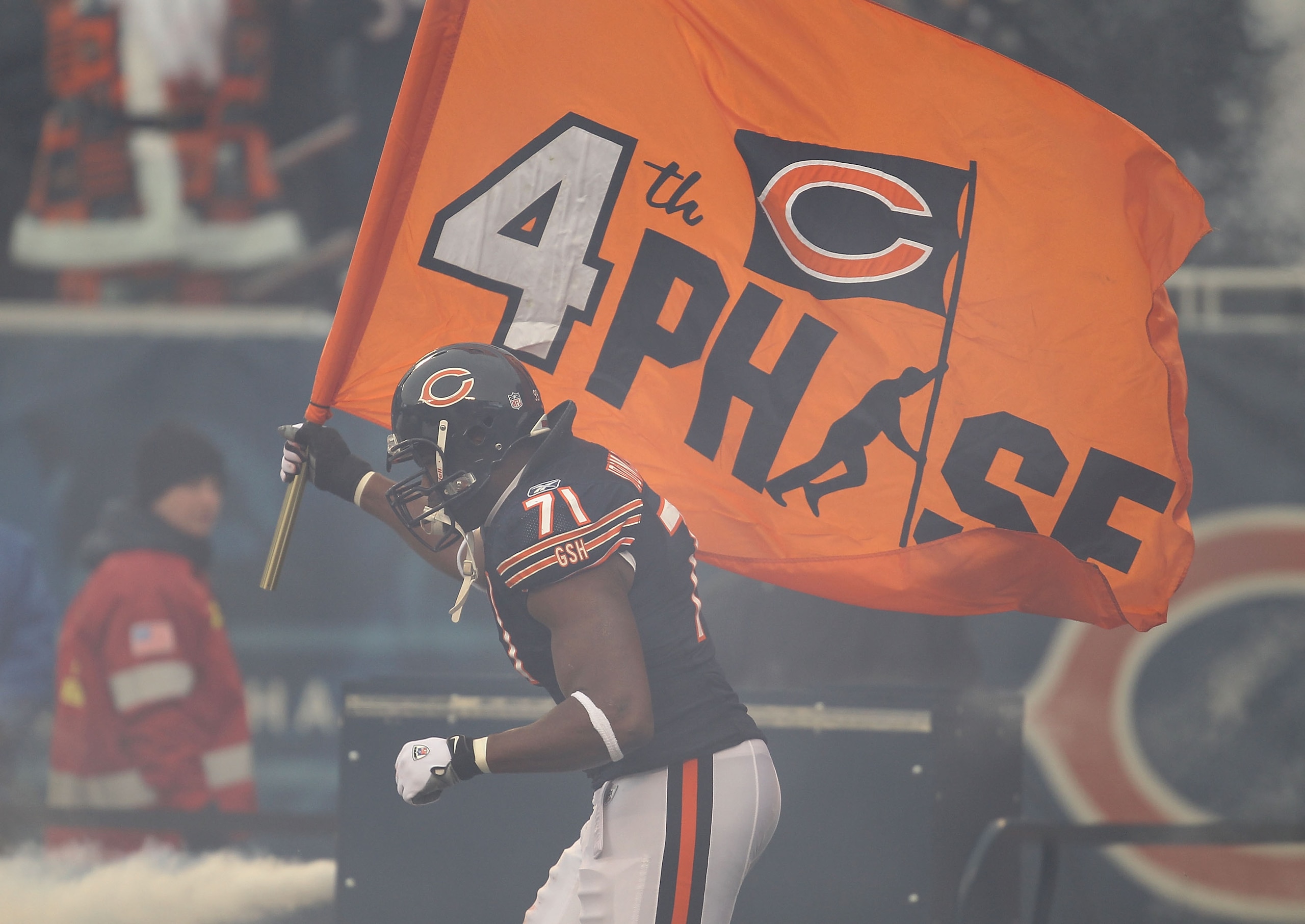 CHICAGO, IL - DECEMBER 26: Israel Idonije #71 of the Chicago Bears runs onto the field during player introductions before a game against the New York Jets at Soldier Field on December 26, 2010 in Chicago, Illinois. The Bears defeated the Jets 38-34. (Phot