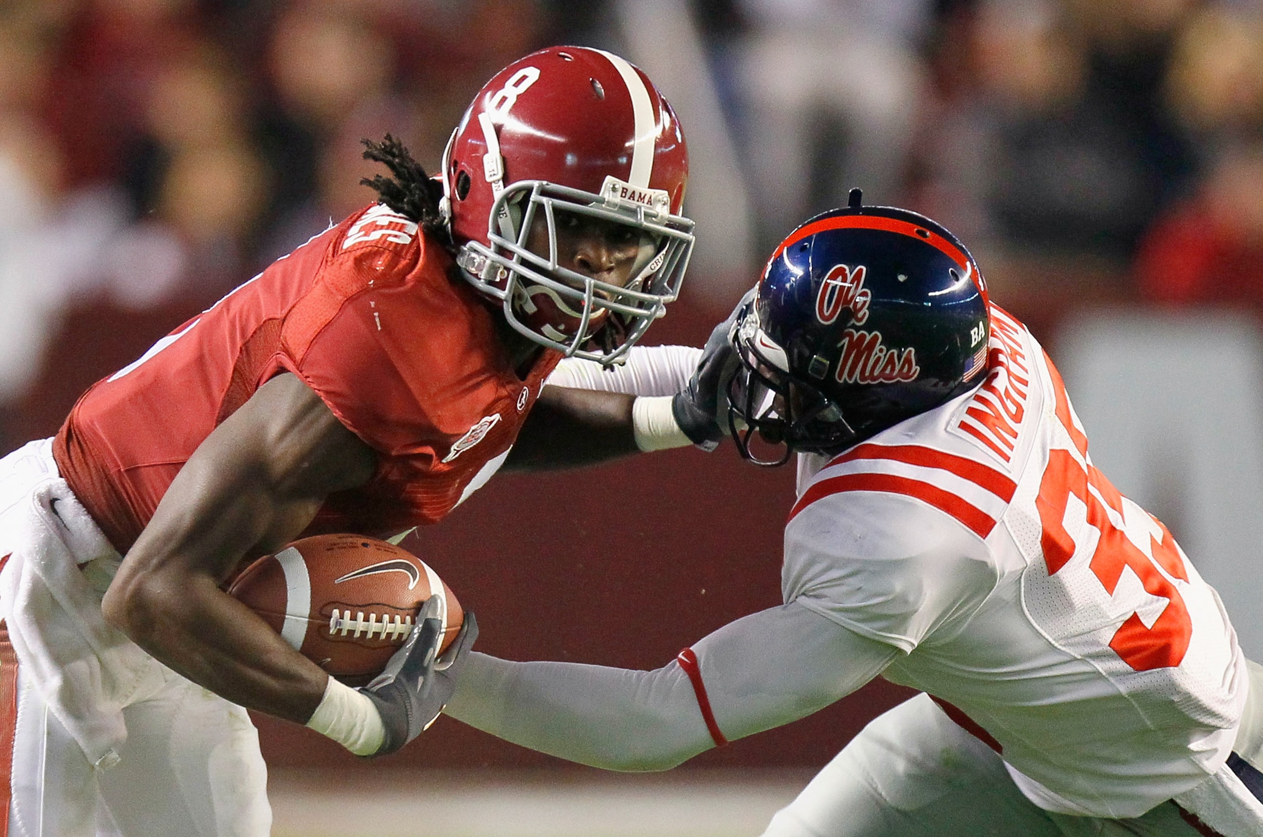 TUSCALOOSA, AL - OCTOBER 16:  Julio Jones #8 of the Alabama Crimson Tide stiffs arms the facemask of Fon Ingram #35 of the Ole Miss Rebels at Bryant-Denny Stadium on October 16, 2010 in Tuscaloosa, Alabama.  (Photo by Kevin C. Cox/Getty Images)