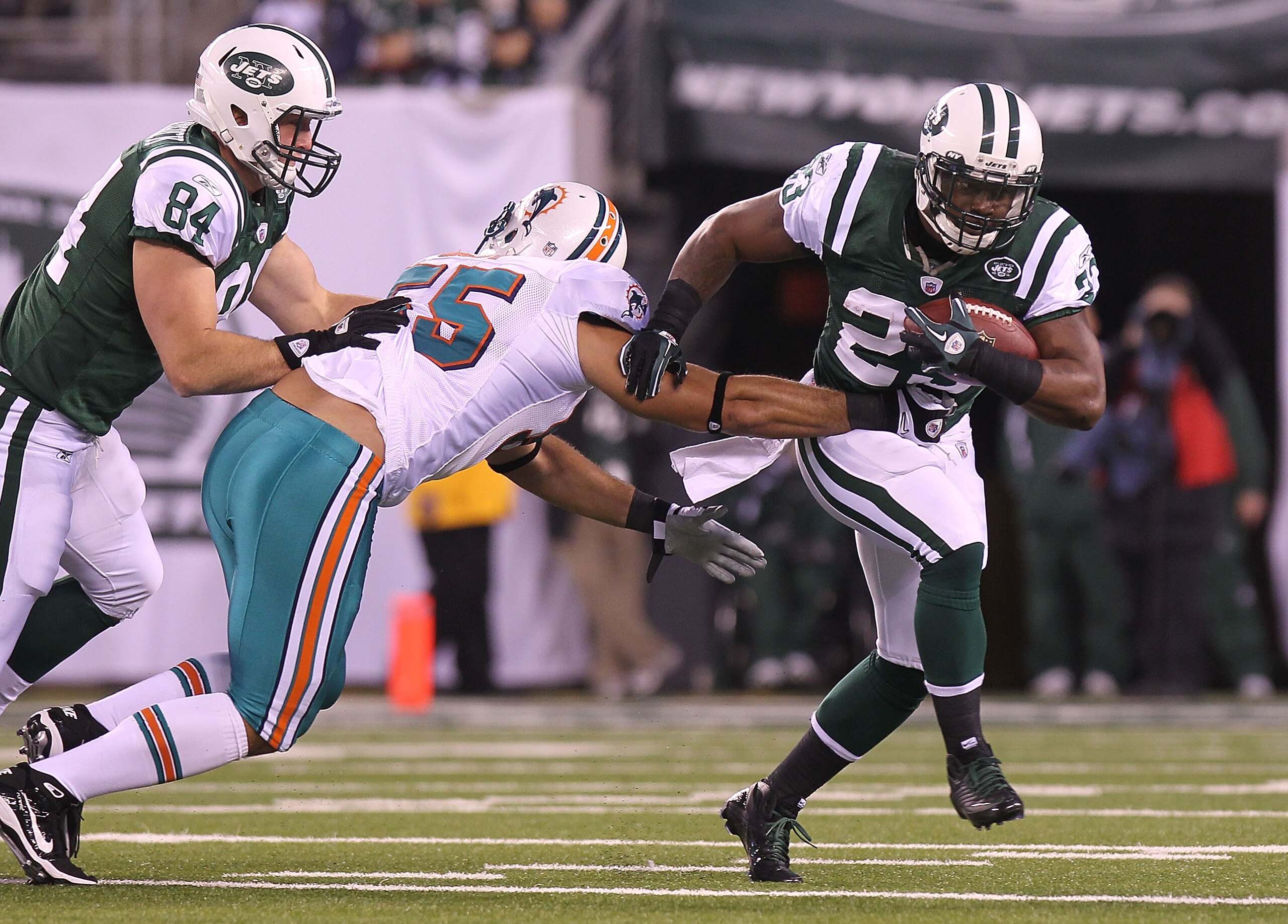 EAST RUTHERFORD, NJ - DECEMBER 12: Shonn Greene #23 of the New York Jets rushes against the Miami Dolphins at New Meadowlands Stadium on December 12, 2010 in East Rutherford, New Jersey.  (Photo by Nick Laham/Getty Images)