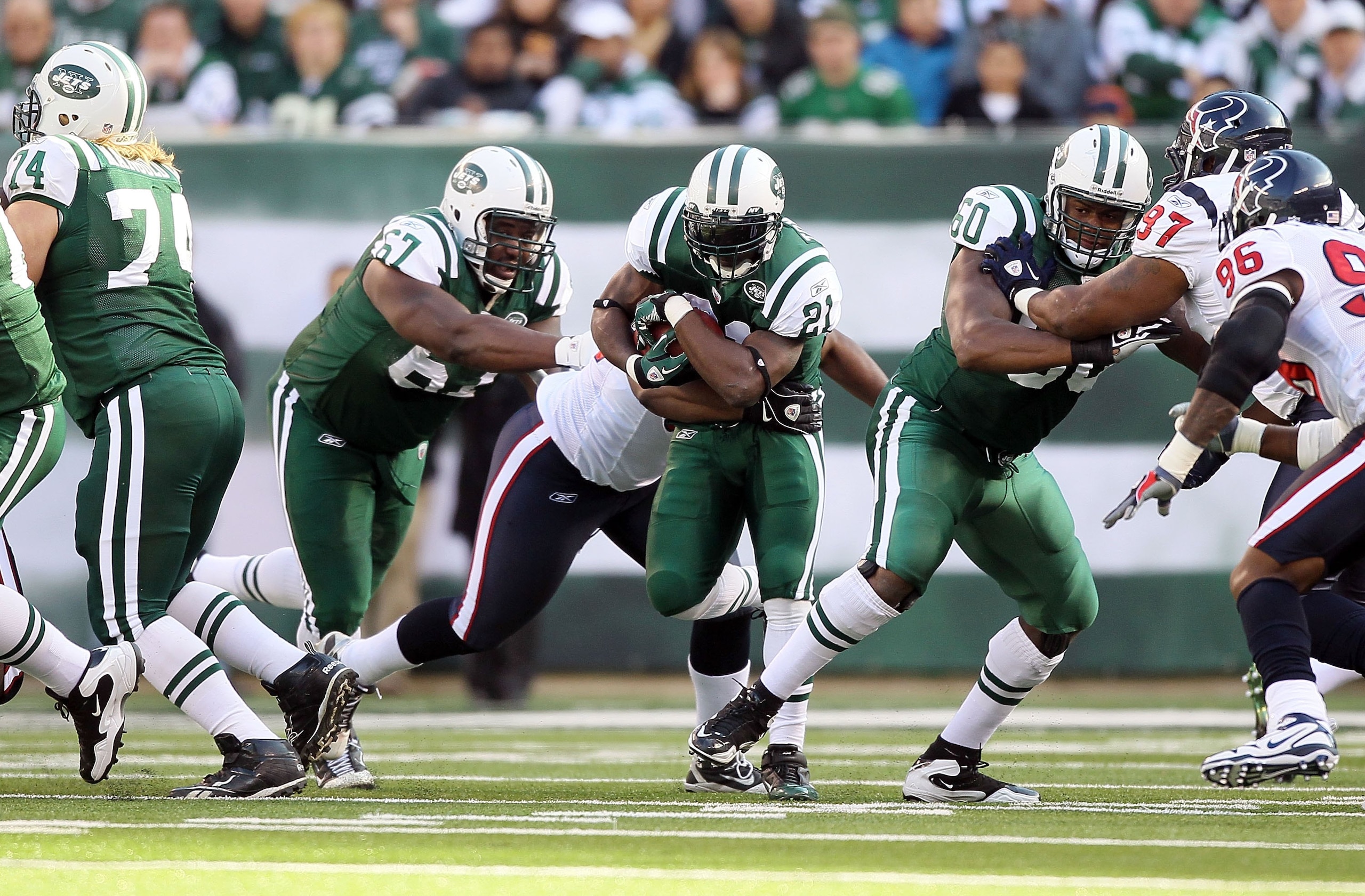 EAST RUTHERFORD, NJ - NOVEMBER 21:  LaDainian Tomlinson #21 of the New York Jets runs against the Houston Texans on November 21, 2010 at the New Meadowlands Stadium in East Rutherford, New Jersey.  (Photo by Jim McIsaac/Getty Images)