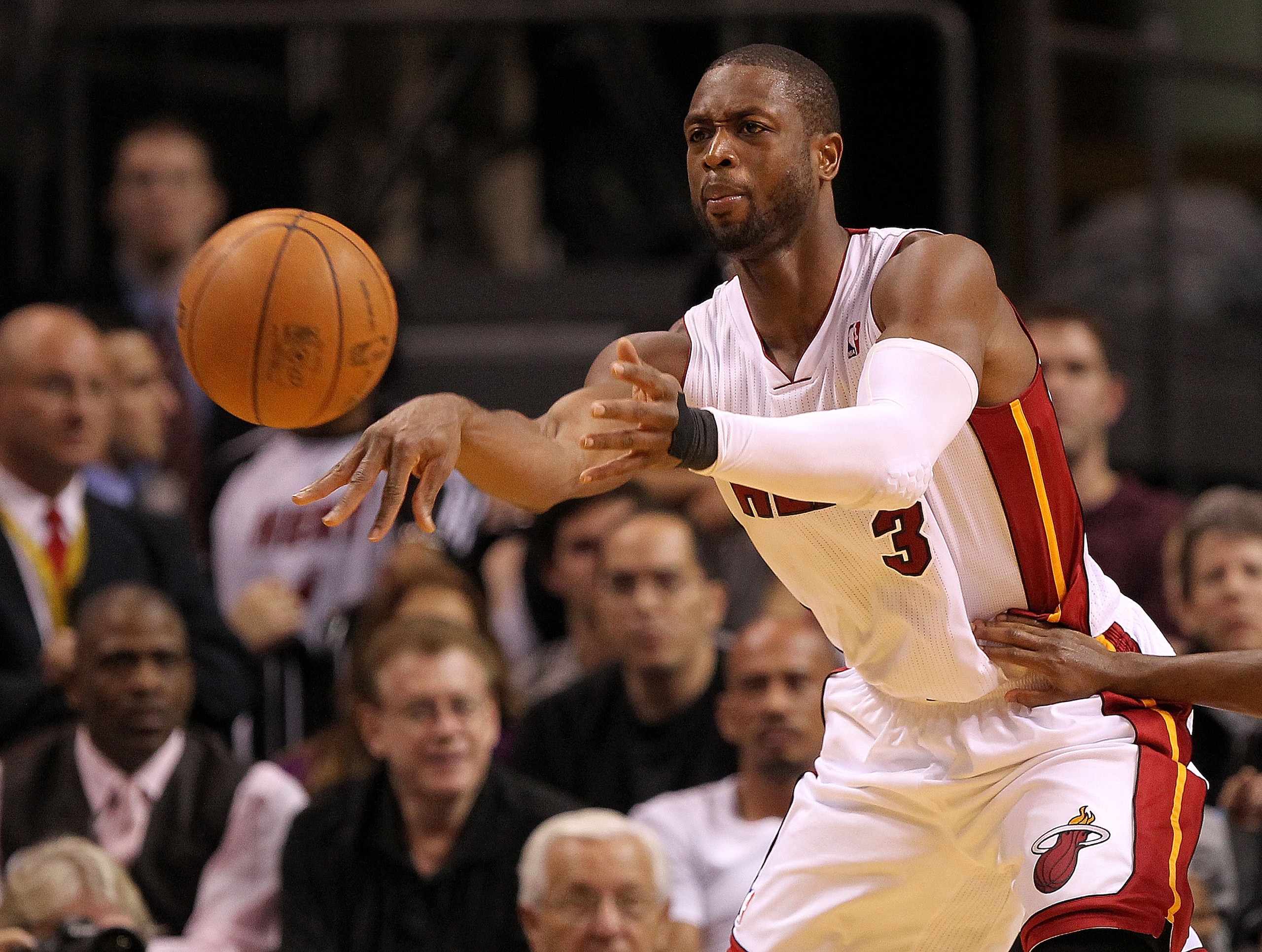 MIAMI, FL - JANUARY 04: Dwyane Wade #3 of the Miami Heat passes the ball during a game against the Milwaukee Bucks at American Airlines Arena on January 4, 2011 in Miami, Florida. NOTE TO USER: User expressly acknowledges and agrees that, by downloading a