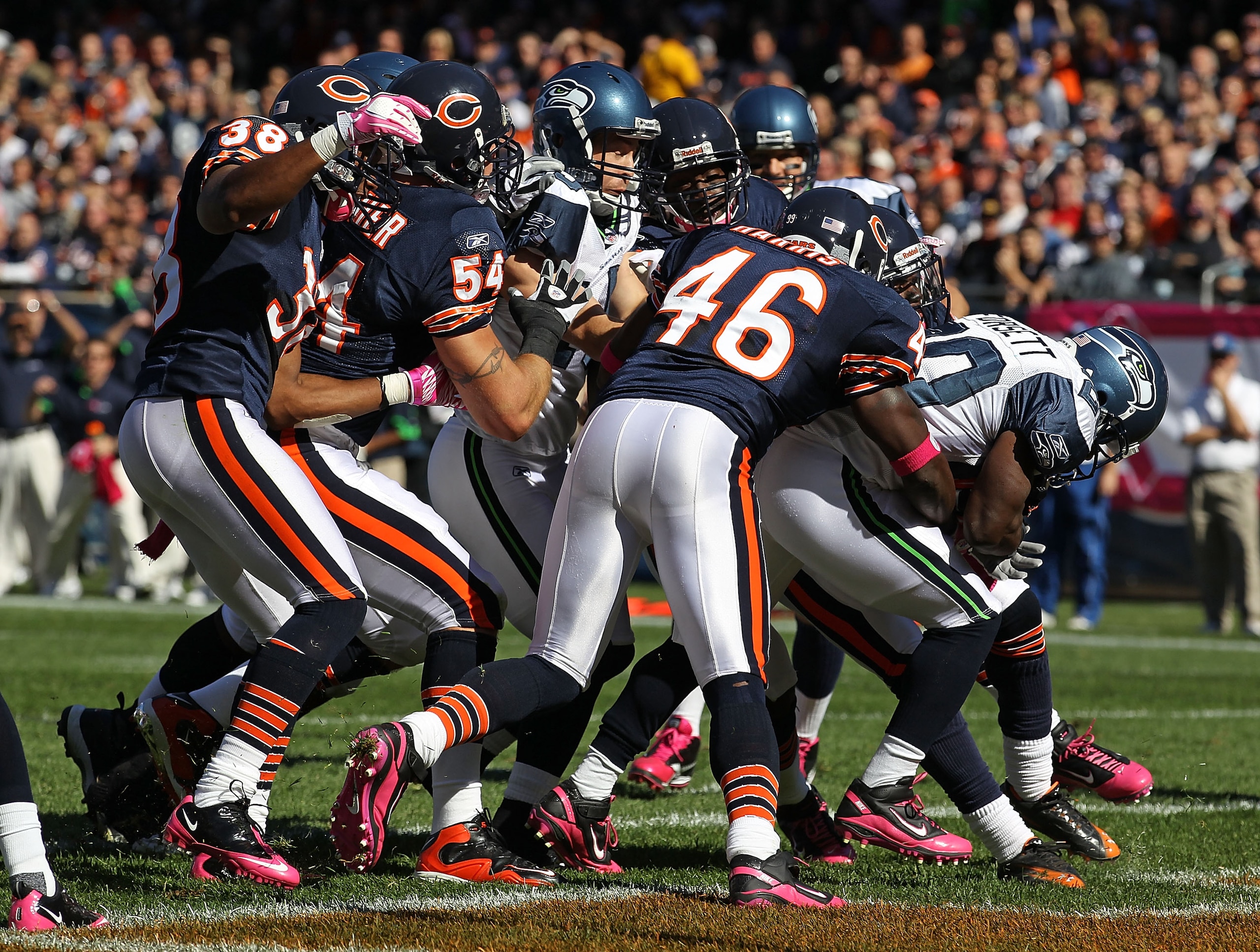 CHICAGO - OCTOBER 17: Justin Forsett #20 of the Seattle Seahawks scores a touchdown pursues by Chris Harris #46, Brian Urlacher #54 and Danieal Manning #38 of the Chicago Bears at Soldier Field on October 17, 2010 in Chicago, Illinois. The Seahawks defeat