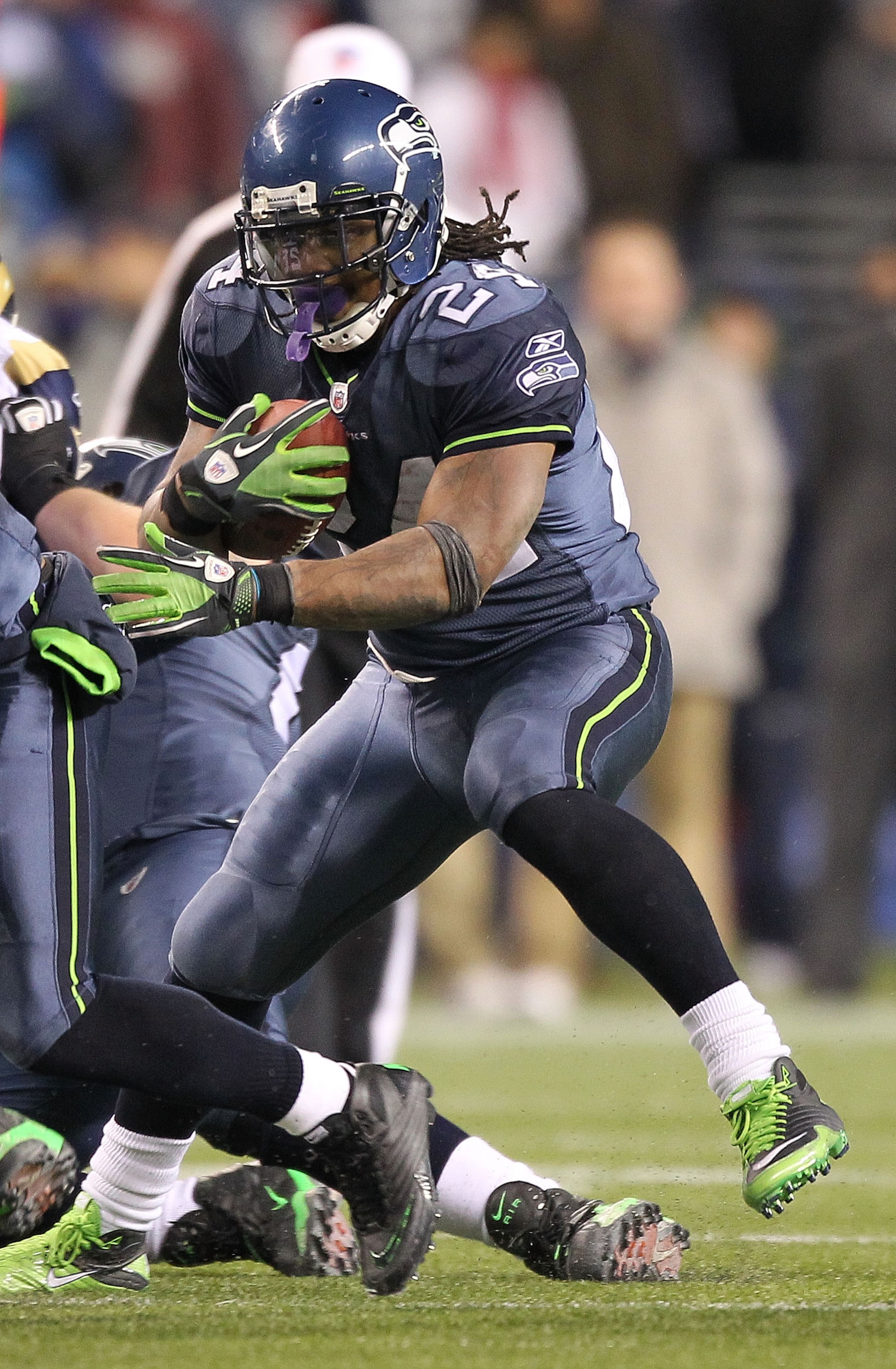 SEATTLE, WA - JANUARY 02: Running back Marshawn Lynch #24 of the Seattle Seahawks rushes with the ball against the St. Louis Rams during their game at Qwest Field on January 2, 2011 in Seattle, Washington. (Photo by Otto Greule Jr/Getty Images) SEATTLE, WA - JANUARY 02: Running back Marshawn Lynch #24 of the Seattle Seahawks rushes with the ball against the St. Louis Rams during their game at Qwest Field on January 2, 2011 in Seattle, Washington. (Photo by Otto Greule Jr/Getty Images)