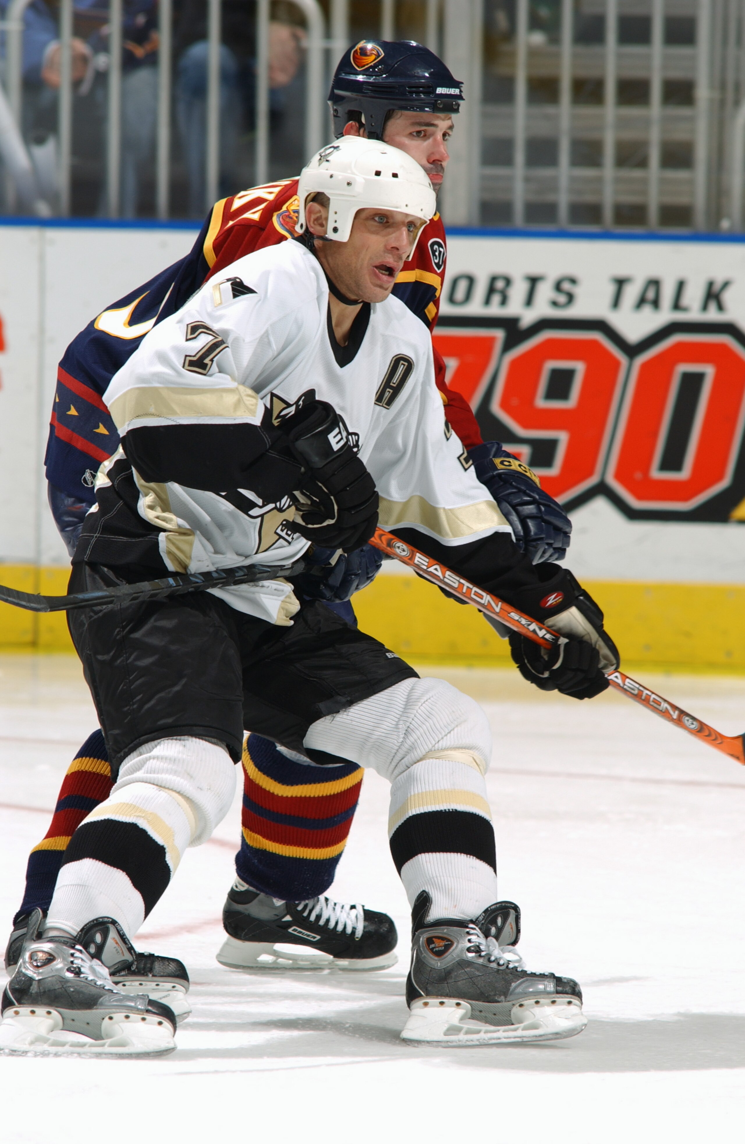 ATLANTA - APRIL 2:  Kelly Buchberger #7 of the Pittsburgh Penguins and Ivan Majesky #23 of the Atlanta Thrashers vie for position on April 2, 2004 at the Philips Arena in Atlanta, Georgia.  The Penguins defeated the Thrashers 3-2.  (Photo by Scott Cunning