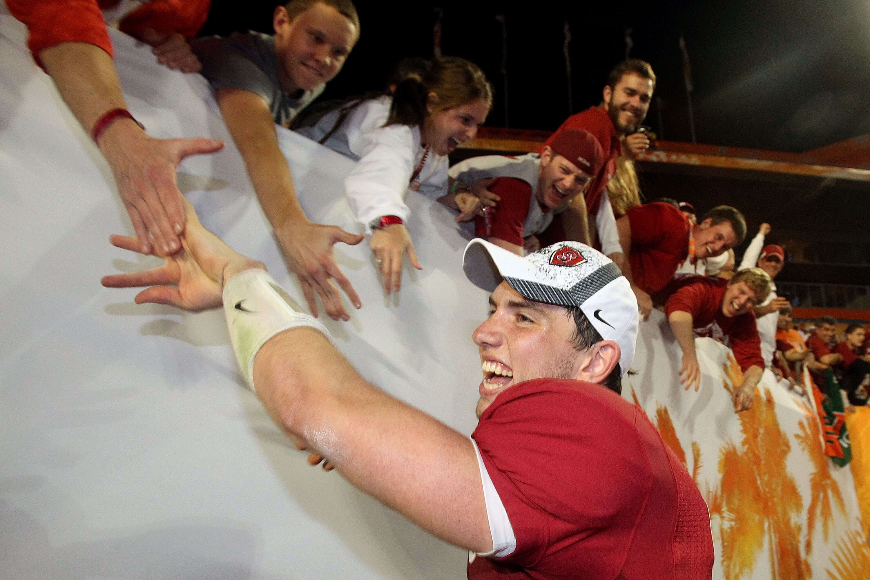 MIAMI, FL - JANUARY 03:  Orange Bowl MVP Andrew Luck of the Stanford Cardinal celebrates with fans after Stanford won 40-14 against the Virginia Tech Hokies during the 2011 Discover Orange Bowl at Sun Life Stadium on January 3, 2011 in Miami, Florida.  (P
