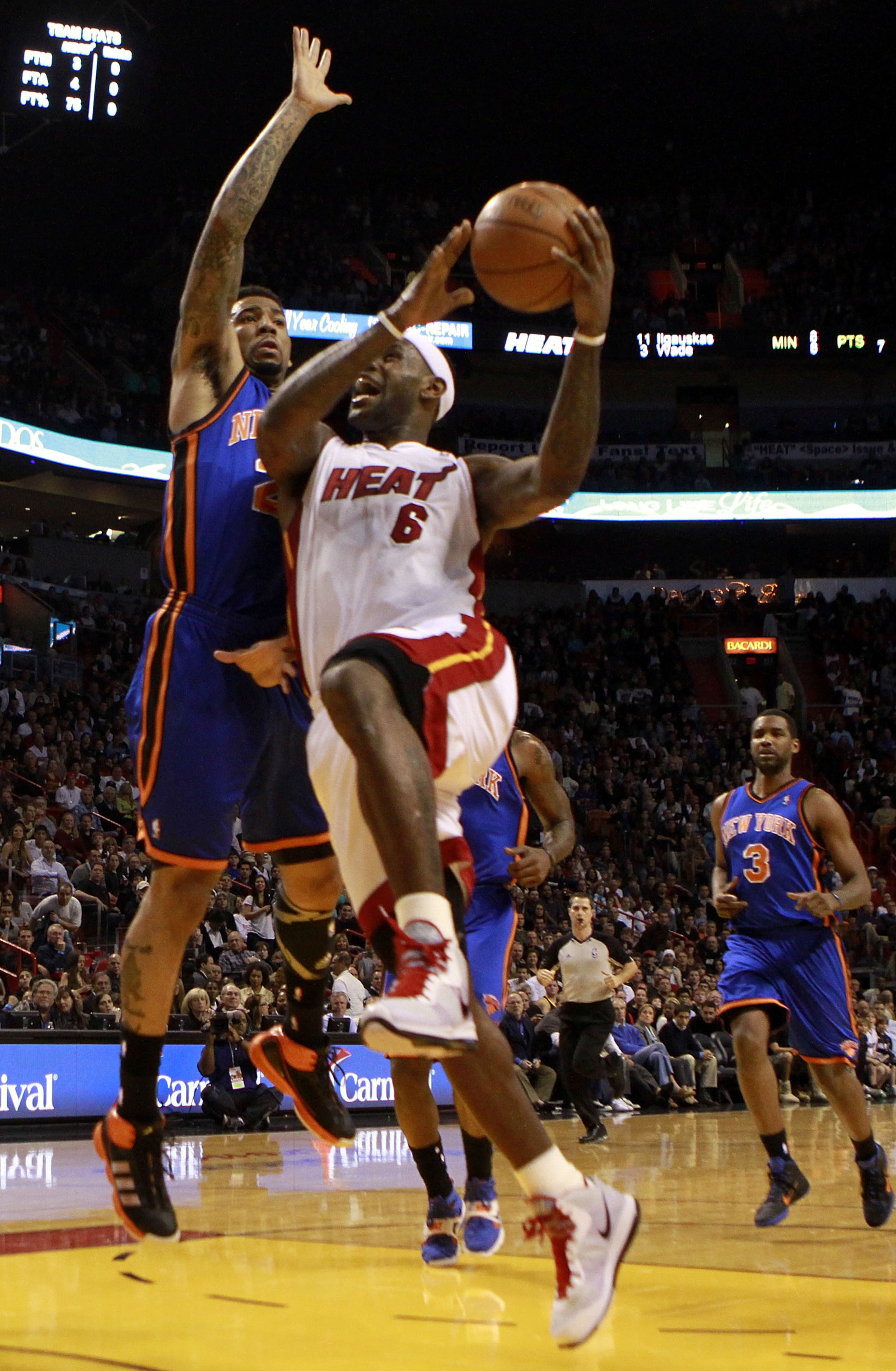 MIAMI - DECEMBER 28:  Forward LeBron James #6 of the Miami Heat is defended by guard Raymond felton #2 of the New York Knicks game at American Airlines Arena on December 28, 2010 in Miami, Florida.  (Photo by Marc Serota/Getty Images)