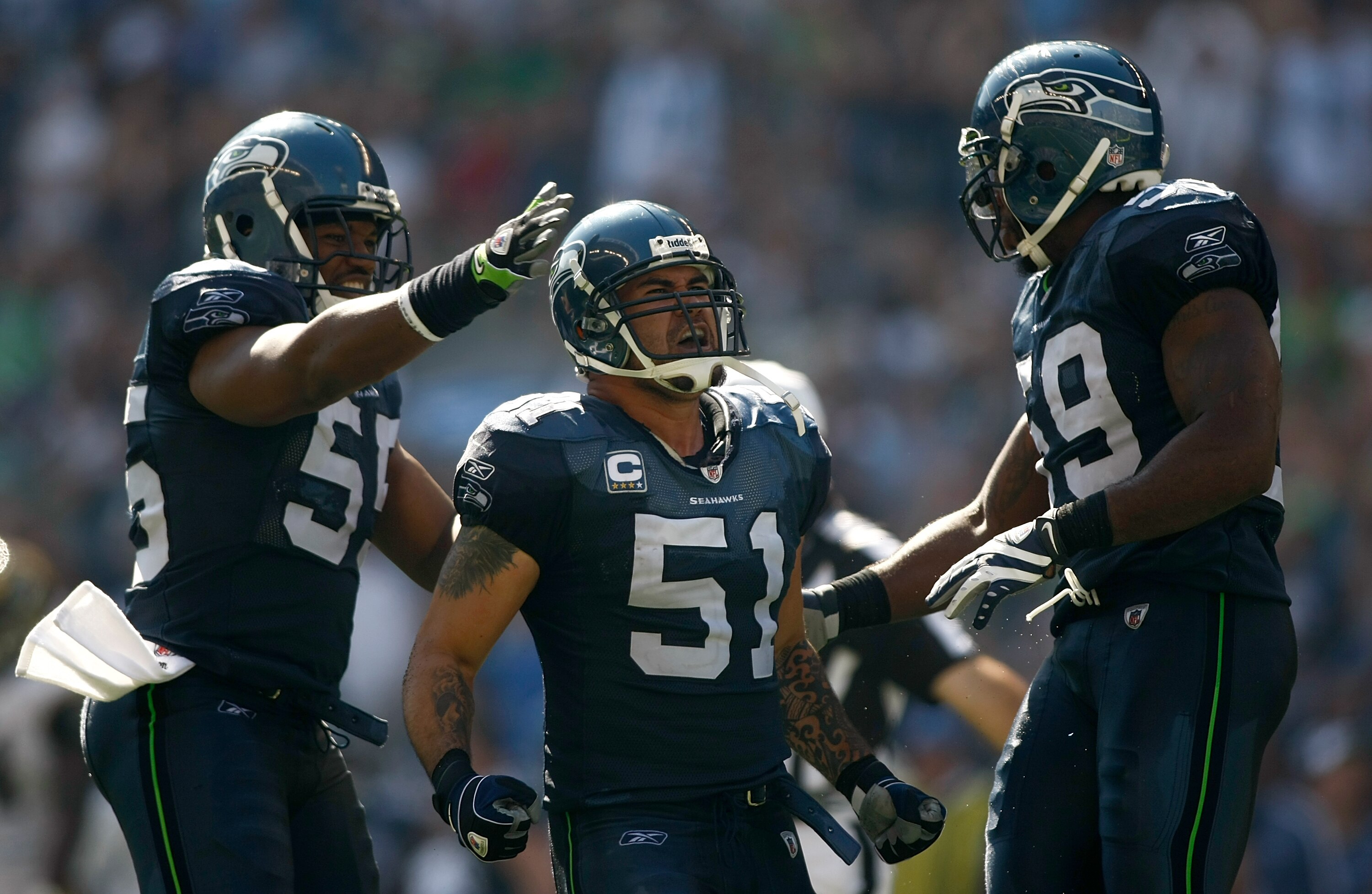 SEATTLE , WA - SEPTEMBER 13:  Lofa Tatupu #51 of the Seattle Seahawks celebrates sacking Marc Bugler #10 of the St. Louis Rams at Qwest Field on September 13, 2009 in Seattle, Washington.  (Photo by Jonathan Ferrey/Getty Images)