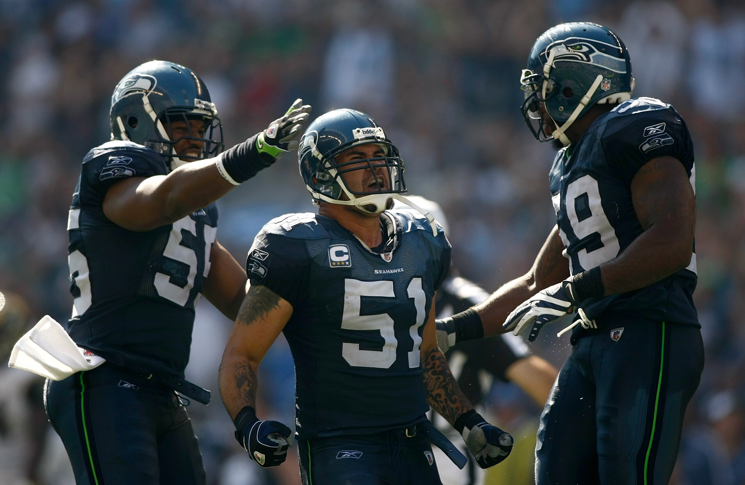 SEATTLE , WA - SEPTEMBER 13:  Lofa Tatupu #51 of the Seattle Seahawks celebrates sacking Marc Bugler #10 of the St. Louis Rams at Qwest Field on September 13, 2009 in Seattle, Washington.  (Photo by Jonathan Ferrey/Getty Images)