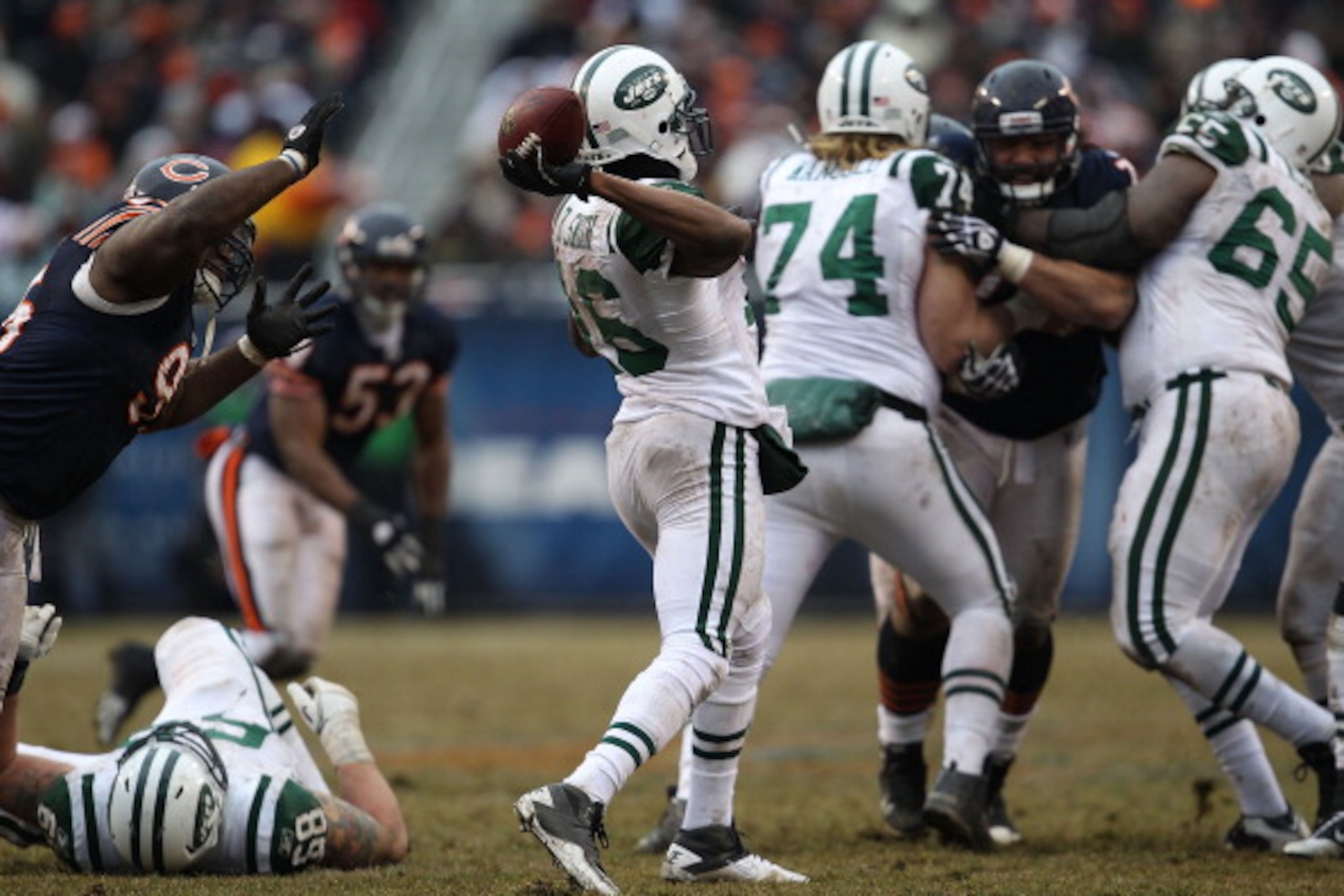 CHICAGO, IL - DECEMBER 26: Brad Smith #16 of the New York Jets throws a pass against the Chicago Bears out of the 'wildcat' formation at Soldier Field on December 26, 2010 in Chicago, Illinois. The Bears defeated the Jets 38-34. (Photo by Jonathan Daniel/