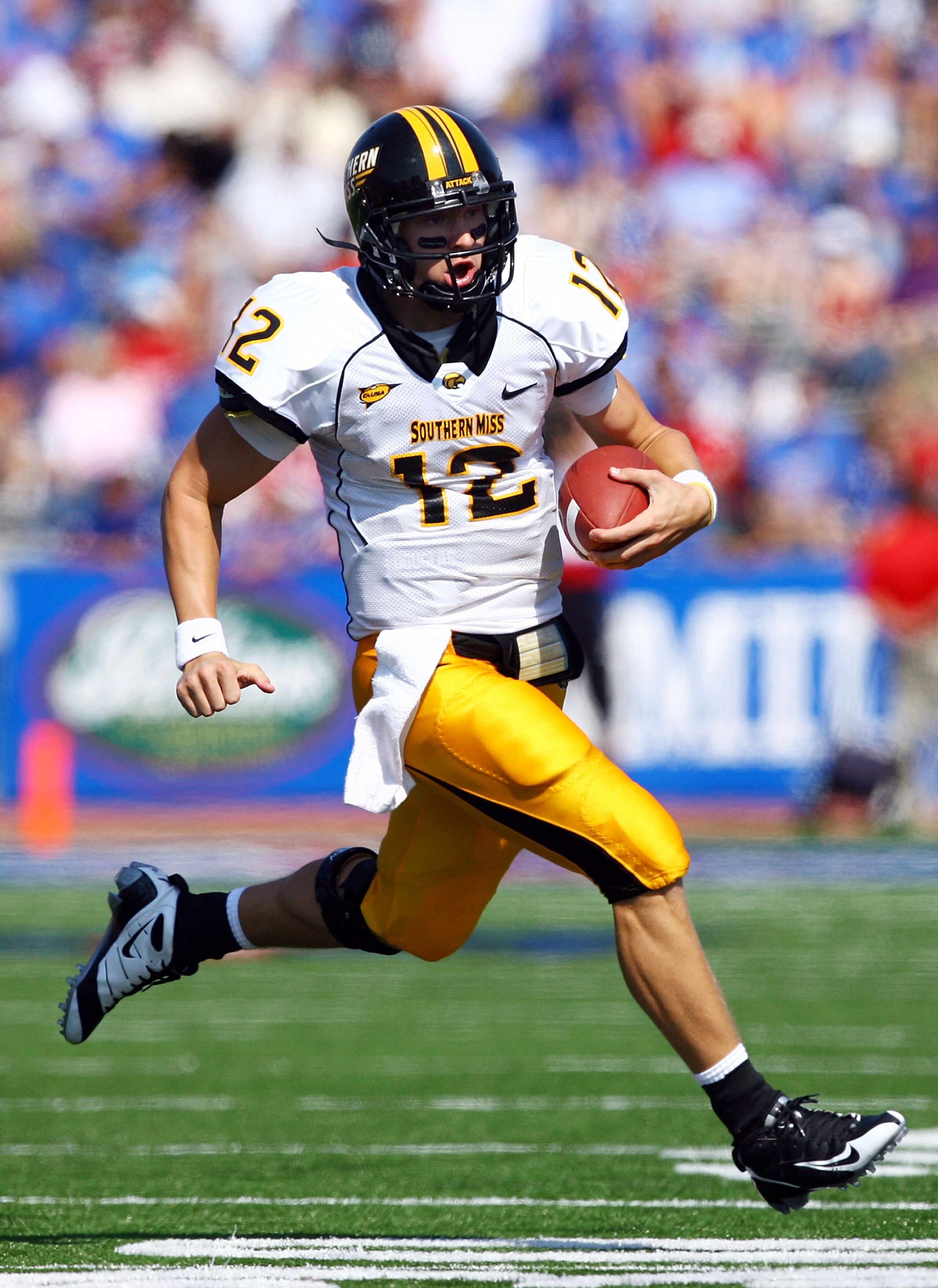 LAWRENCE, KS - SEPTEMBER 26: Quarterback Austin Davis #12 of the Southern Mississippi Golden Eagles scrambles during the game against the Kansas Jayhawks on September 26, 2009 at Memorial Stadium in Lawrence, Kansas. (Photo by Jamie Squire/Getty Images) LAWRENCE, KS - SEPTEMBER 26: Quarterback Austin Davis #12 of the Southern Mississippi Golden Eagles scrambles during the game against the Kansas Jayhawks on September 26, 2009 at Memorial Stadium in Lawrence, Kansas. (Photo by Jamie Squire/Getty Images)