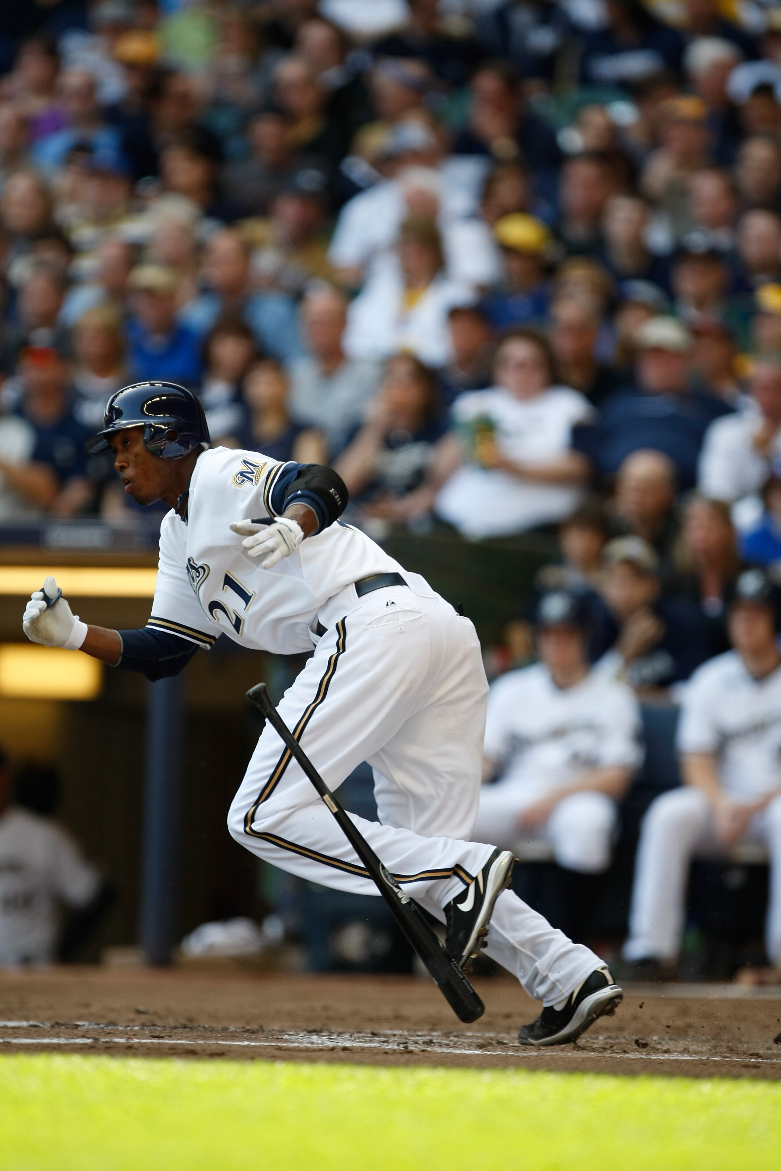 MILWAUKEE, WI - APRIL 05: Shortstop Alcides Escobar #21 of the Milwaukee Brewers runs after hitting the baseball against the Colorado Rockies at the Miller Park on April 05, 2010 in Milwaukee, Wisconsin. The Rockies defeated the Brewers 5-3.(Photo by Scot