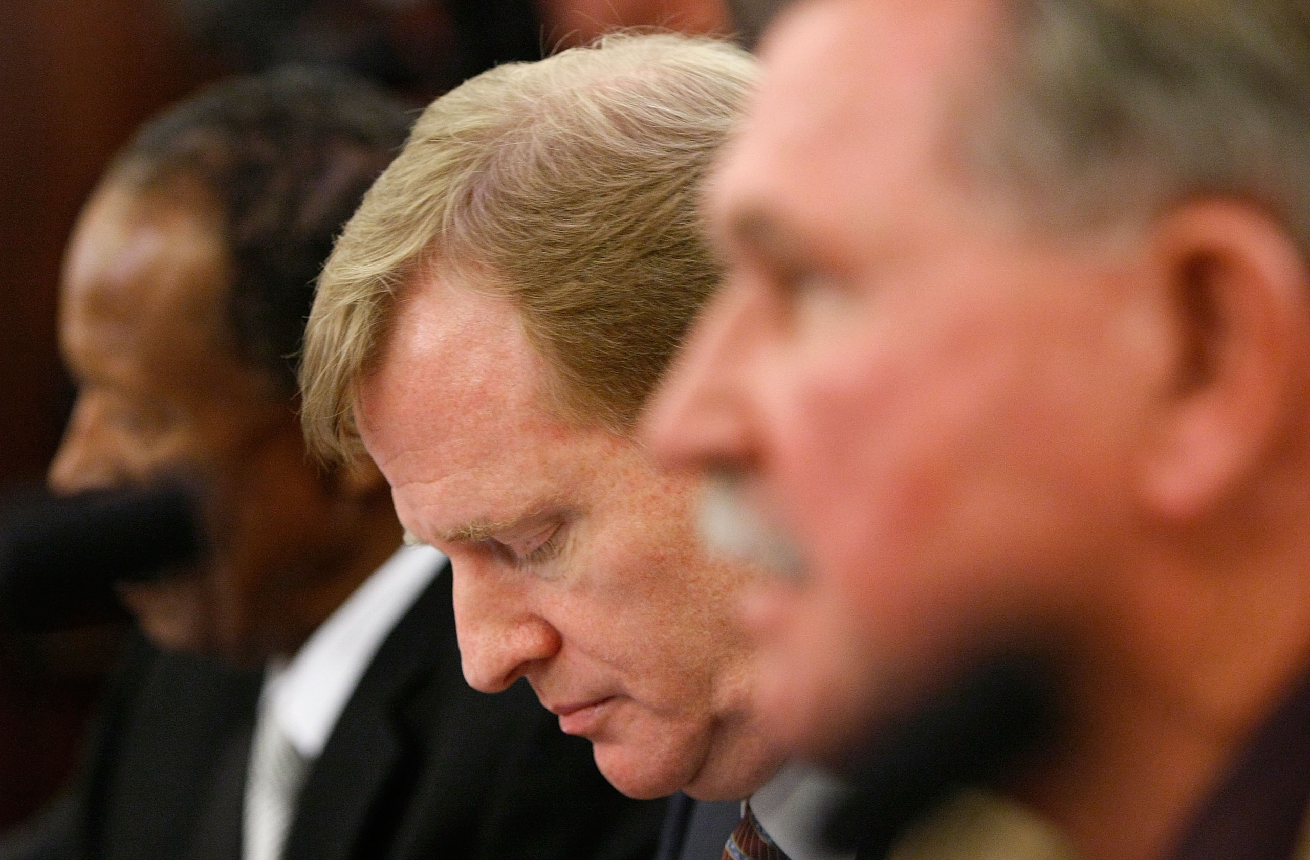WASHINGTON - SEPTEMBER 18:  NFL Commissioner Roger Goodell (C) listens to testimony during a hearing of the Senate Commerce, Science and Transportation Committee with NFL Players Association Executive Director Gene Upshaw (L) and Pro Football Hall of Fame