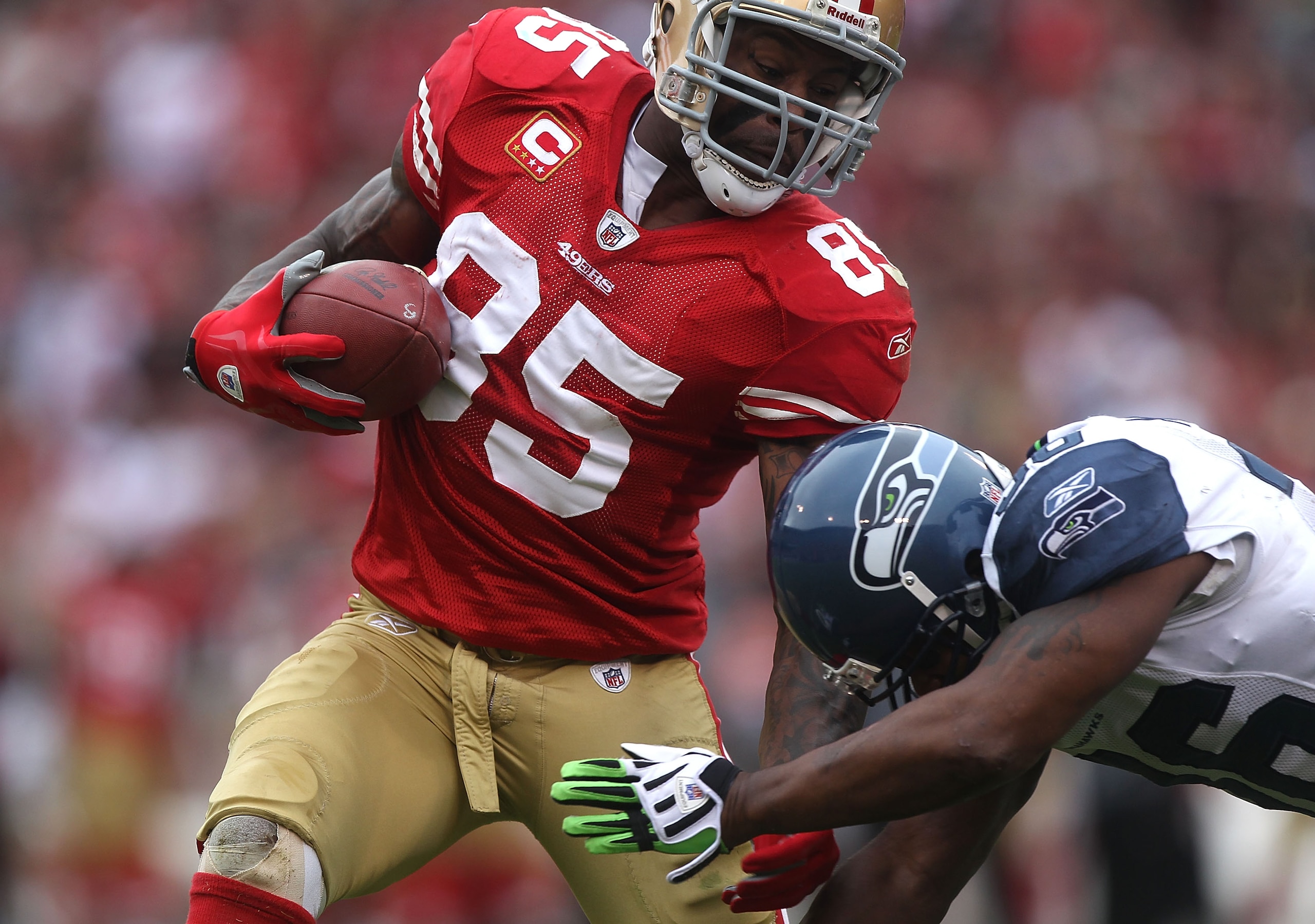 SAN FRANCISCO - DECEMBER 12: Vernon Davis #85 of the San Francisco 49ers runs after a catch as Lawyer Milloy #36 of the Seattle Seahawks defends during an NFL game at Candlestick Park on December 12, 2010 in San Francisco, California. (Photo by Jed Jaco SAN FRANCISCO - DECEMBER 12: Vernon Davis #85 of the San Francisco 49ers runs after a catch as Lawyer Milloy #36 of the Seattle Seahawks defends during an NFL game at Candlestick Park on December 12, 2010 in San Francisco, California. (Photo by Jed Jaco