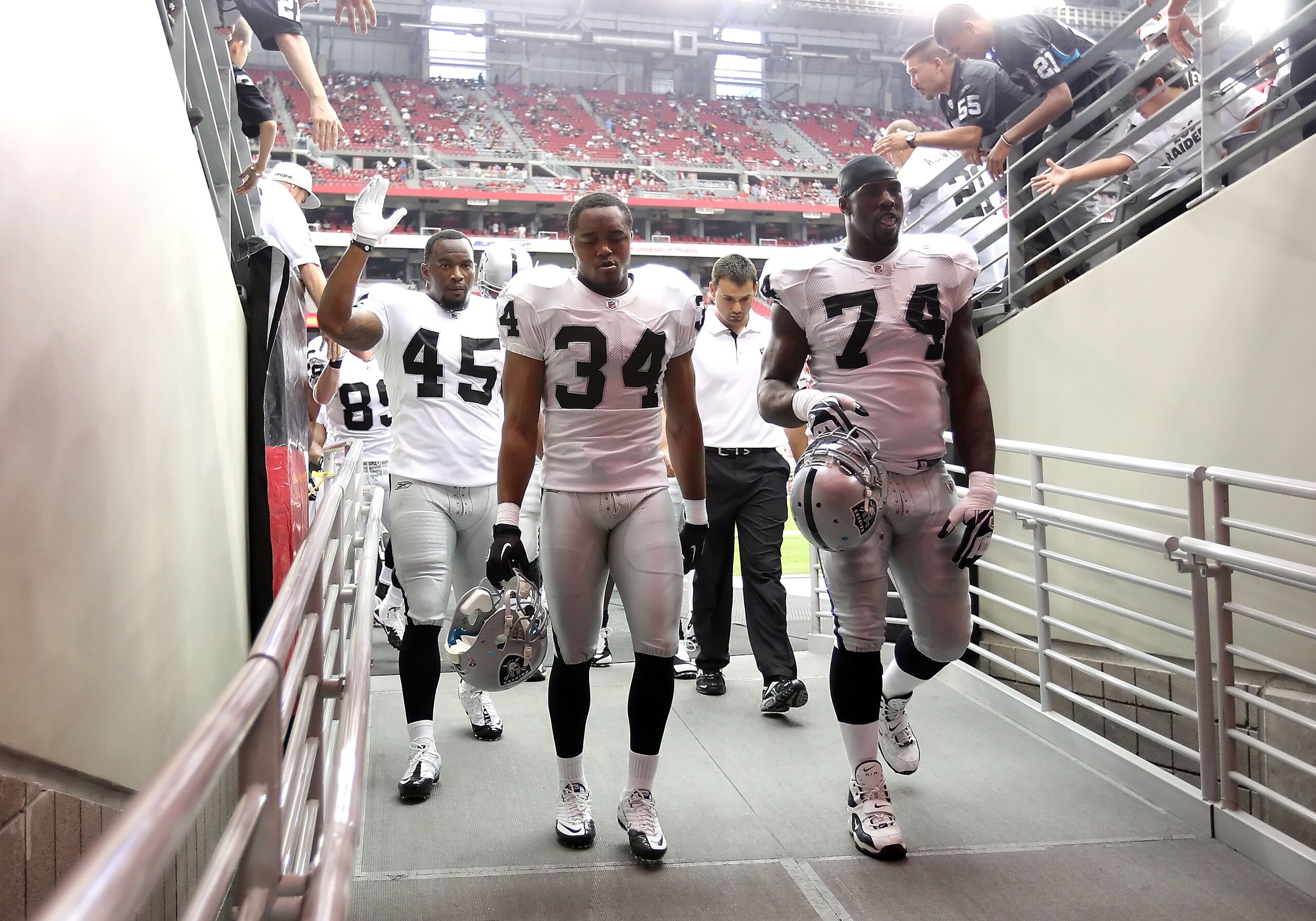 GLENDALE, AZ - SEPTEMBER 26:  (L-R) Marcel Reece #45, Mike Mitchell #34 and Bruce Campbell #73 of the Oakland Raiders before the NFL game against the Arizona Cardinals at the University of Phoenix Stadium on September 26, 2010 in Glendale, Arizona.  The C