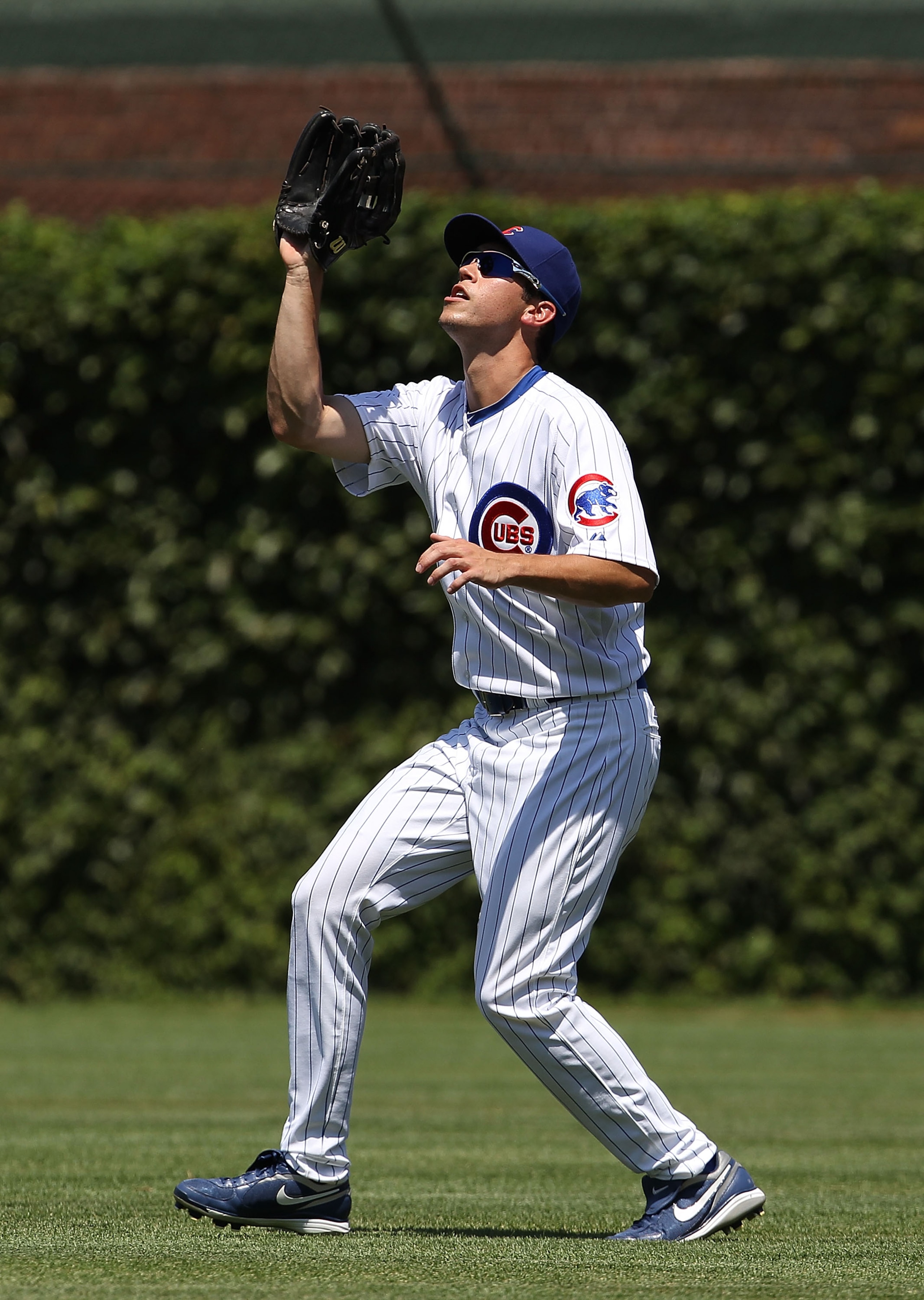 CHICAGO - JULY 16: Tyler Colvin #21 of the Chicago Cubs waits to catch the ball against the Philadelphia Phillies at Wrigley Field on July 16, 2010 in Chicago, Illinois. The Cubs defeated the Phillies 4-3. (Photo by Jonathan Daniel/Getty Images)