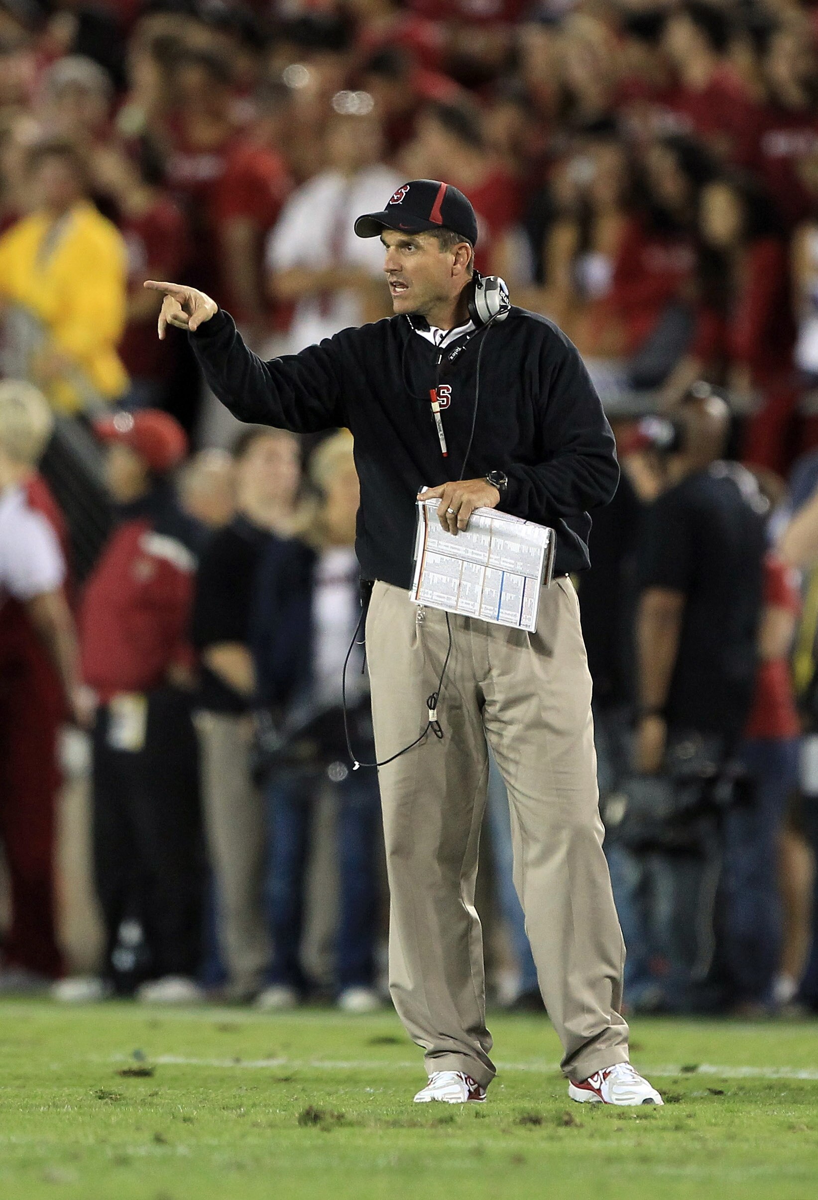 PALO ALTO, CA - OCTOBER 09:  Head coach Jim Harbaugh of the Stanford Cardinal points to the referee during their game against the USC Trojans at Stanford Stadium on October 9, 2010 in Palo Alto, California.  (Photo by Ezra Shaw/Getty Images)