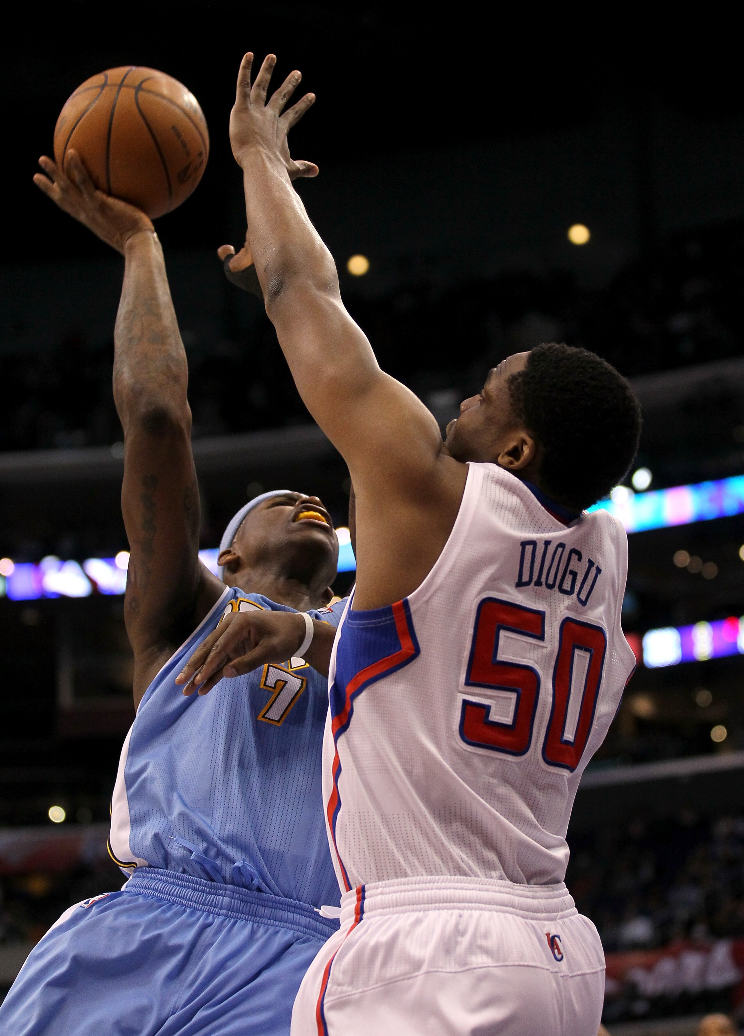 LOS ANGELES, CA - JANUARY 5:  Al Harrington #7 of the Denver Nuggets shoots over Ike Diogu #50 of the Los Angeles Clippers at Staples Center on January 5, 2011  in Los Angeles, California.  The Clippers won 106-93.  NOTE TO USER: User expressly acknowledg