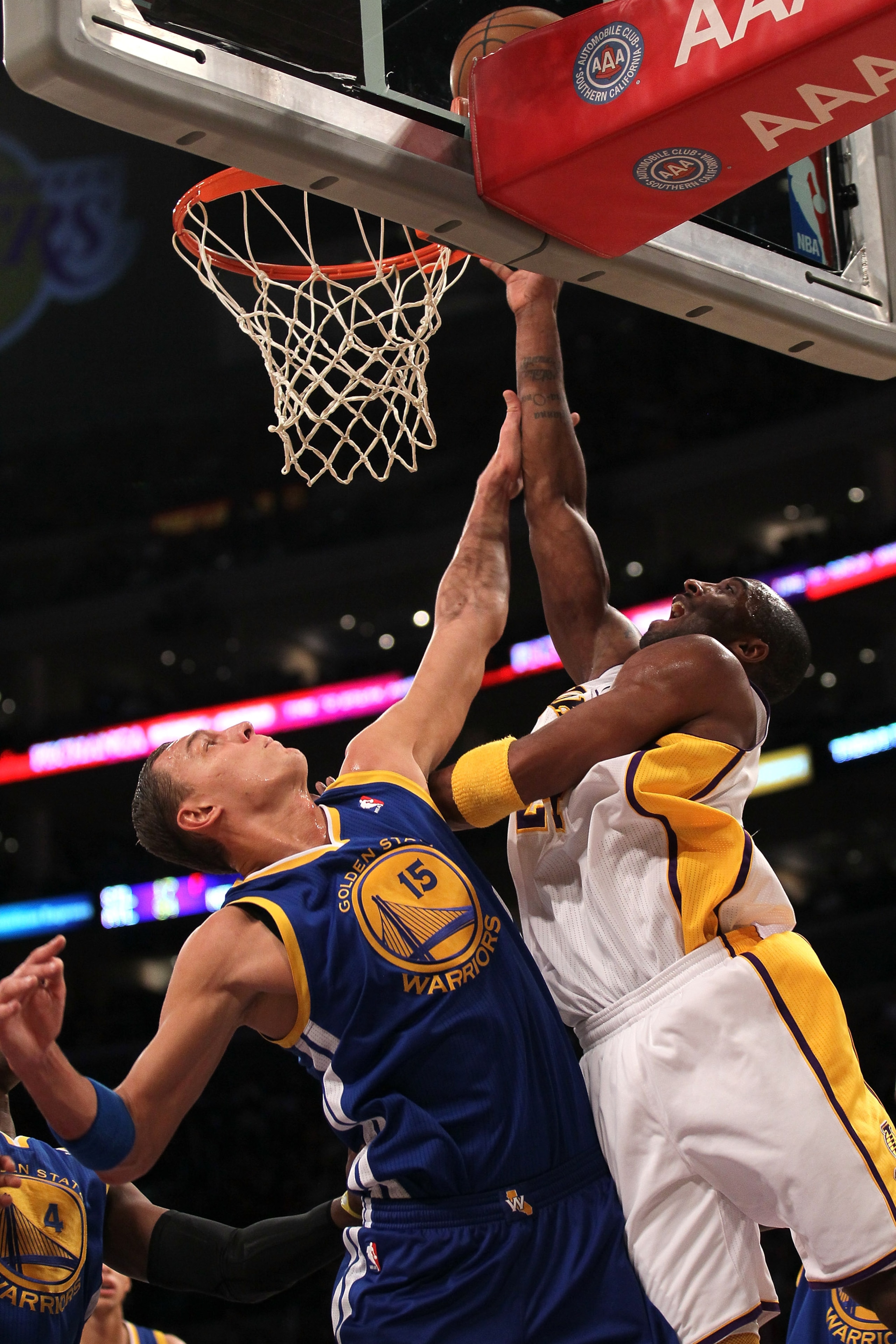 LOS ANGELES, CA - NOVEMBER 21:  Kobe Bryant #24 of the Los Angeles Lakers shoots over Andris Biedrins #15 of the Golden State Warriors at Staples Center on November 21, 2010 in Los Angeles, California.  The User expressly acknowledges and agrees that, by