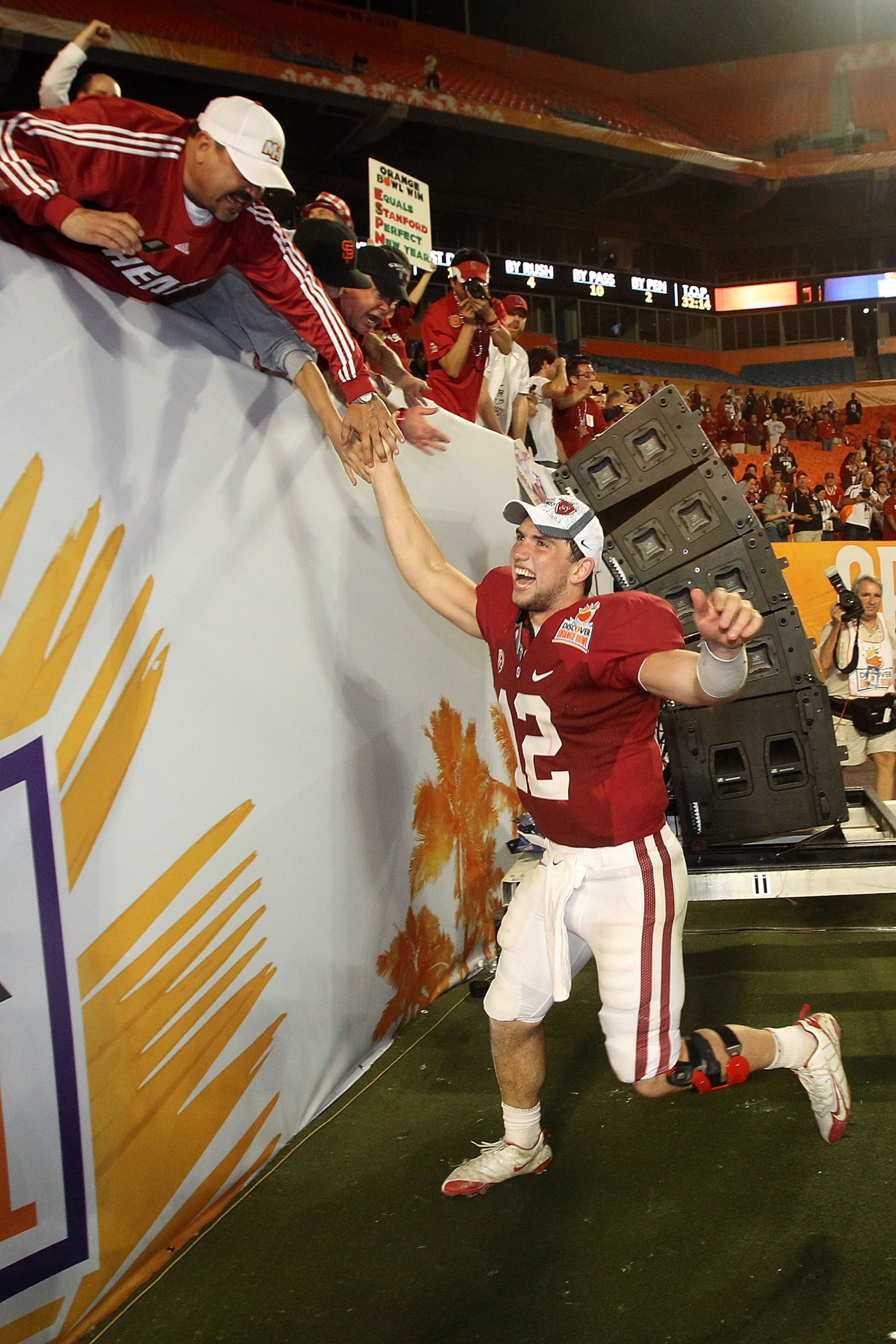 MIAMI, FL - JANUARY 03: Orange Bowl MVP Andrew Luck of the Stanford Cardinal celebrates with fans after Stanford won 40-14 against the Virginia Tech Hokies during the 2011 Discover Orange Bowl at Sun Life Stadium on January 3, 2011 in Miami, Florida. (P MIAMI, FL - JANUARY 03: Orange Bowl MVP Andrew Luck of the Stanford Cardinal celebrates with fans after Stanford won 40-14 against the Virginia Tech Hokies during the 2011 Discover Orange Bowl at Sun Life Stadium on January 3, 2011 in Miami, Florida. (P