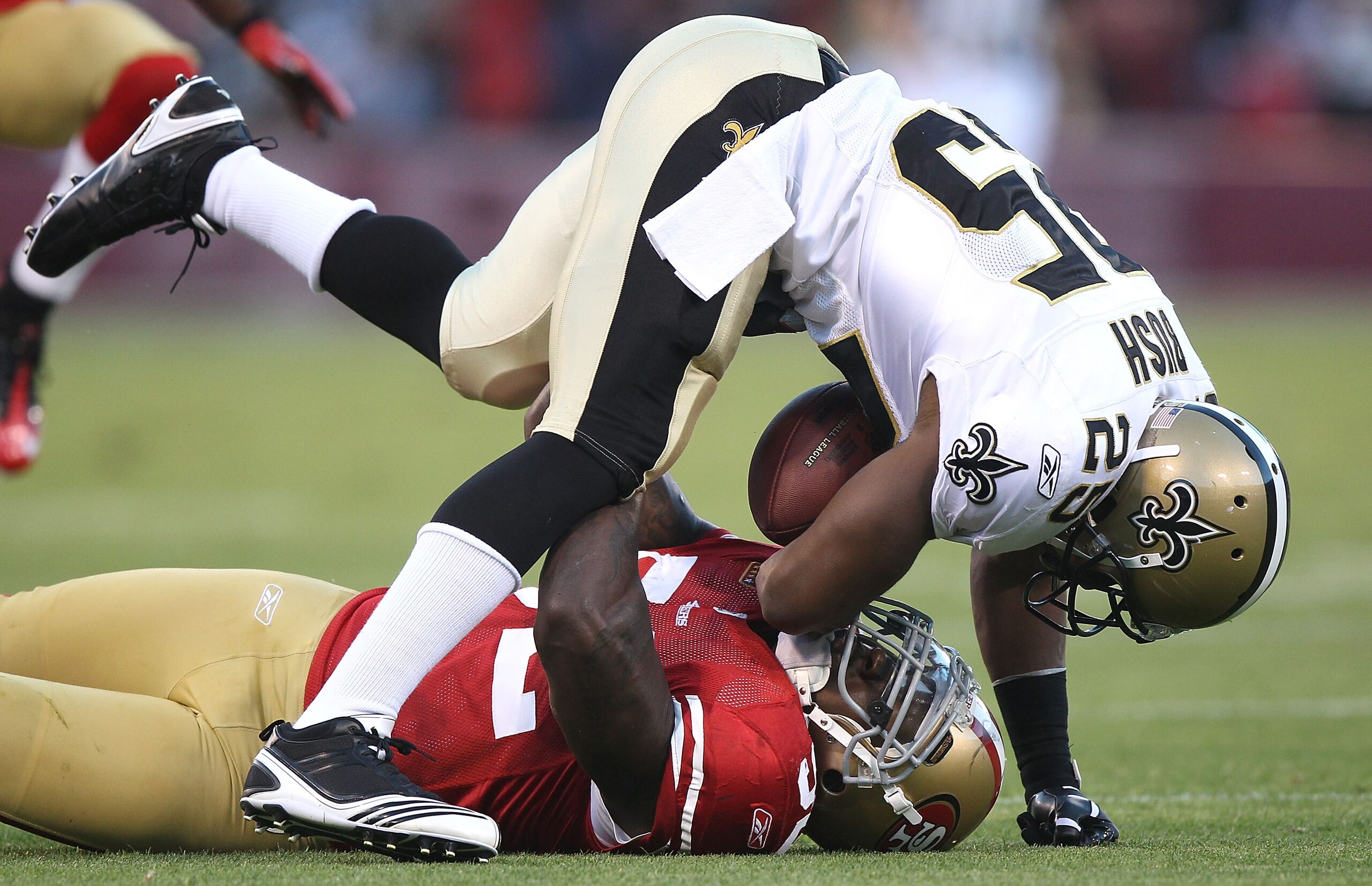 SAN FRANCISCO - SEPTEMBER 20:  Patrick Willis #52 of the San Francisco 49er tackles Reggie Bush #25 of the New Orleans Saints during an NFL game at Candlestick Park on September 20, 2010 in San Francisco, California.  (Photo by Jed Jacobsohn/Getty Images)