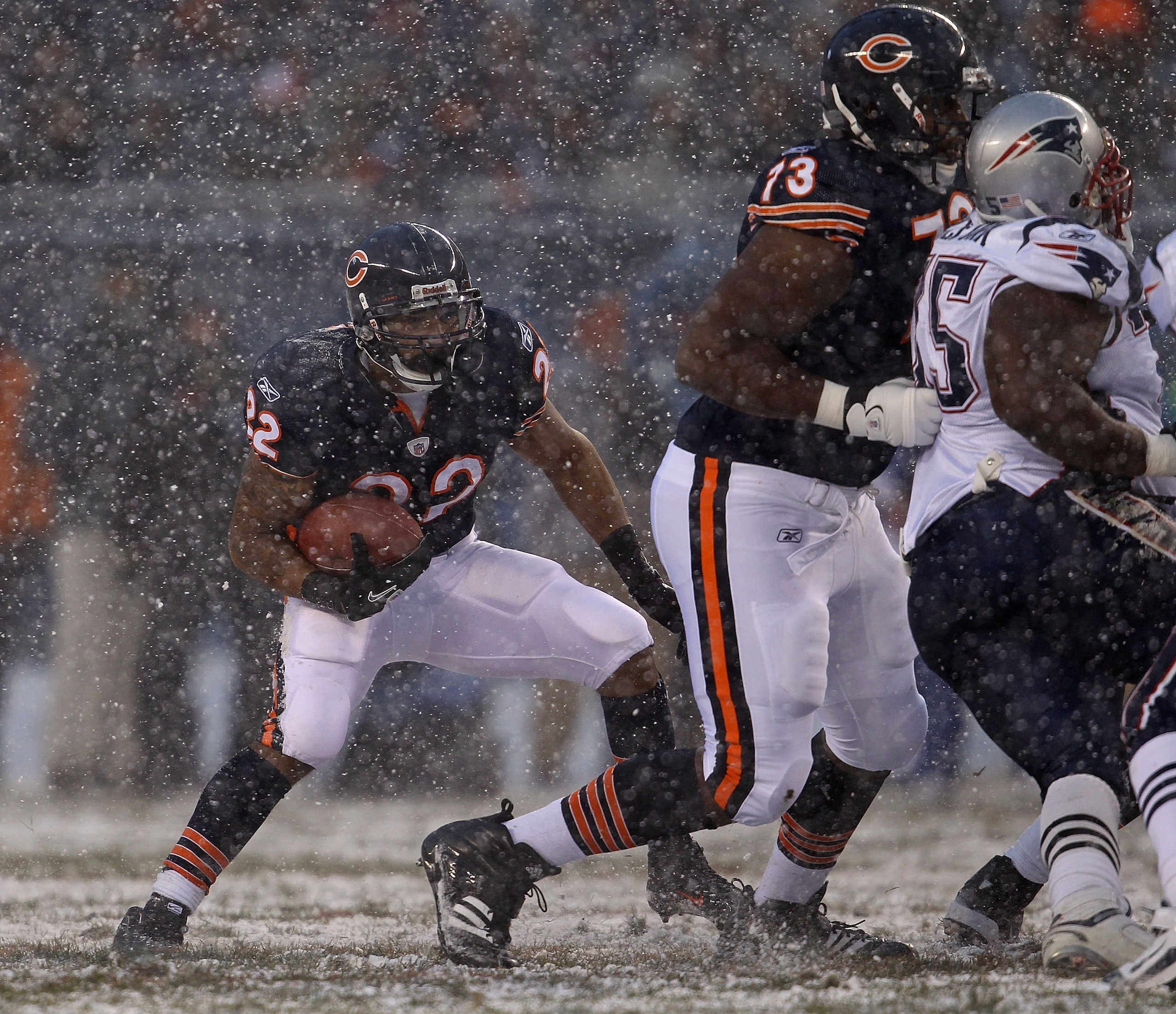 CHICAGO, IL - DECEMBER 12: Matt Forte #22 of the Chicago Bears looks for running room against the New England Patriots at Soldier Field on December 12, 2010 in Chicago, Illinois. The Patriots defeated the Bears 36-7. (Photo by Jonathan Daniel/Getty Images